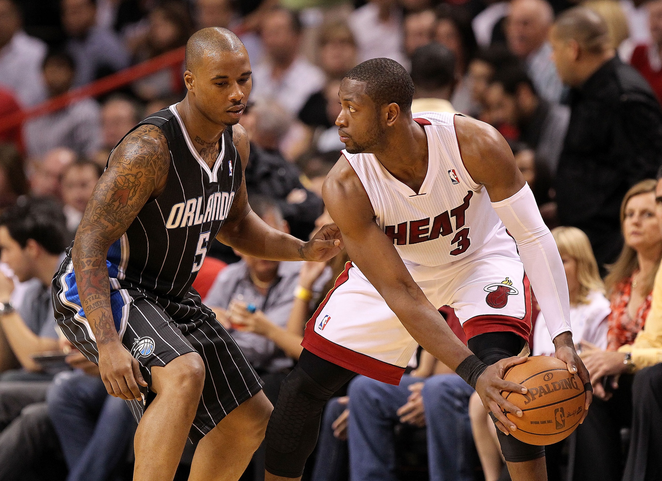 MIAMI, FL - MARCH 03:  Dwyane Wade #3 of the Miami Heat posts up Quentin Richardson #23 of the Orlando Magic during a game at American Airlines Arena on March 3, 2011 in Miami, Florida. NOTE TO USER: User expressly acknowledges and agrees that, by downloa