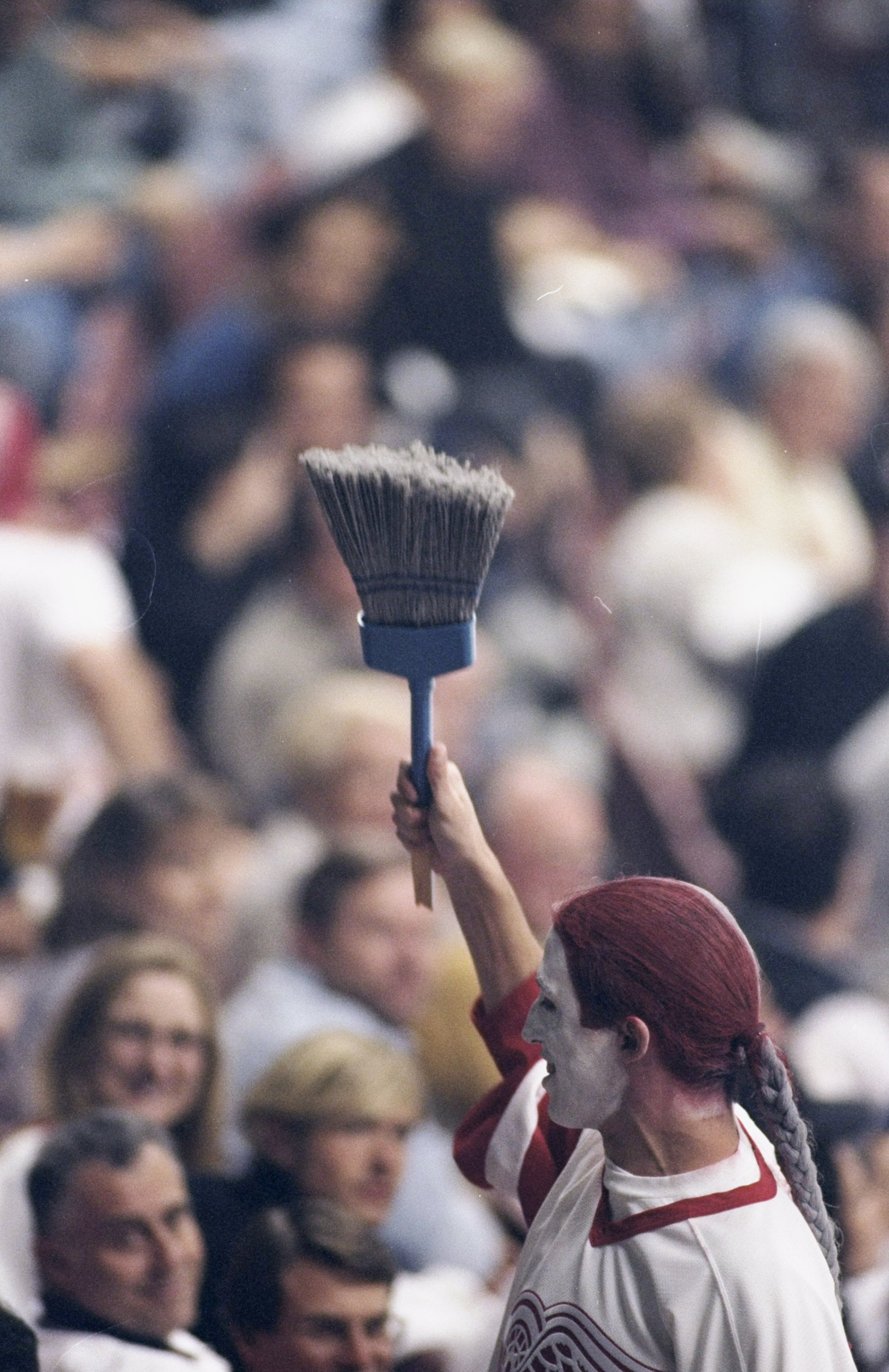 27 Apr 1999: A fan of the Detroit Red Wings cheers as he carries a broom during the Stanley Cup Playoffs against the Anaheim Mighty Ducks at the Arrowhead Pond in Anaheim, California. The Red Wings defeated the Ducks 3-0Mandatory Credit: Donald Miralle  /