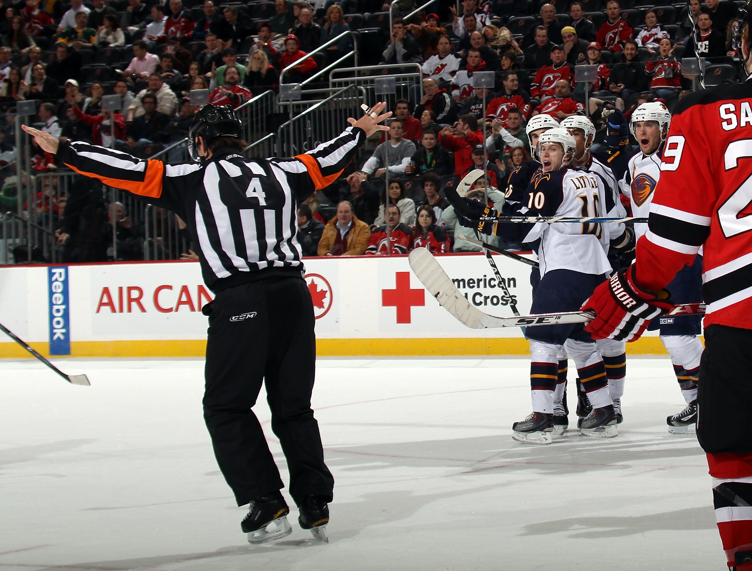 NEWARK, NJ - MARCH 15:  Referee Wes McCauley #4  calls off a last minute goal in the game against the Atlanta Thrashers and the New Jersey Devils at the Prudential Center on March 15, 2011 in Newark, New Jersey. The Devils defeated the Thrashers 4-2.  (Ph