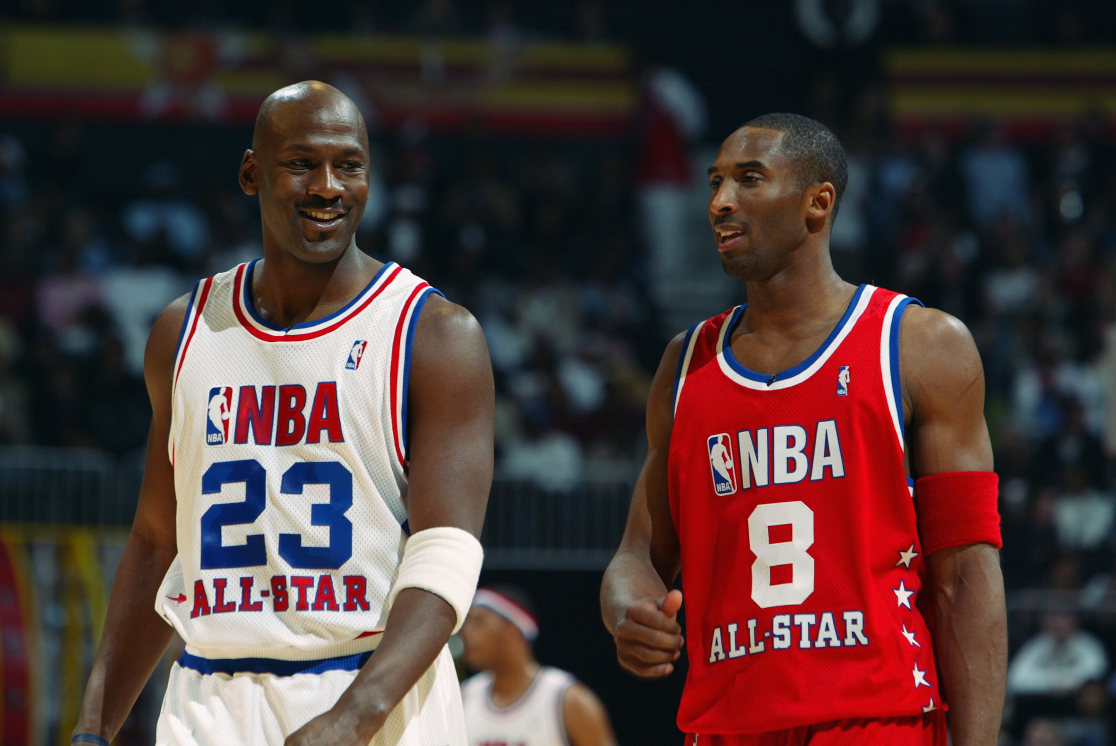 ATLANTA - FEBRUARY 9:  Michael Jordan (Washington Wizards) #23 of the Eastern Conference All-Stars talks with Kobe Bryant (Los Angeles Lakers) #8 of the Western Conference All-Stars at the 2003 NBA All-Star Game on February 9, 2003 at Philips Arena in Atl