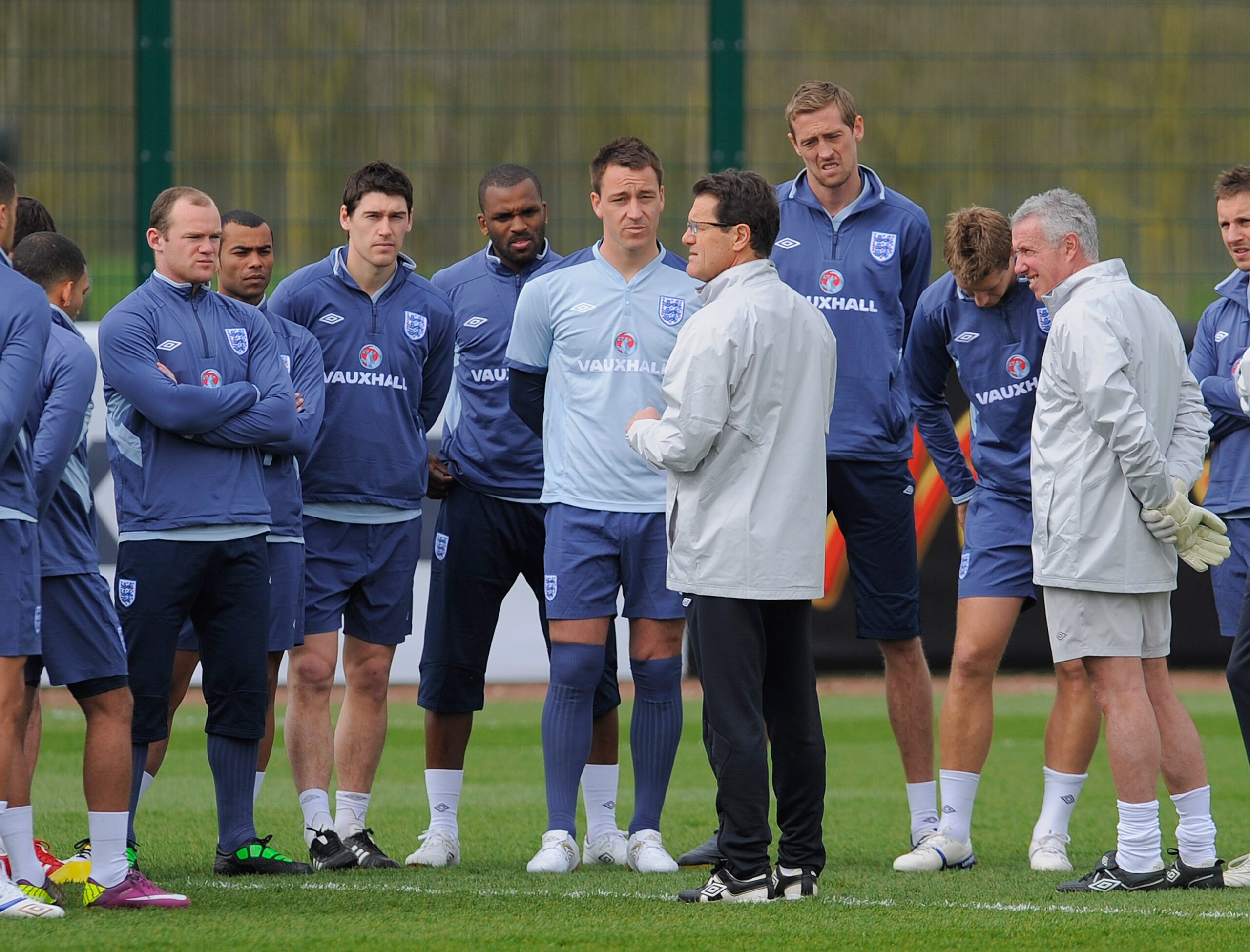 ST ALBANS, ENGLAND - MARCH 22: England manager Fabio Capello speaks to Wayne Rooney, Gareth Barry, Darren Bent, John Terry and Peter Crouch during the England training session ahead of their UEFA EURO 2012 qualifier against Wales, at London Colney on Marc