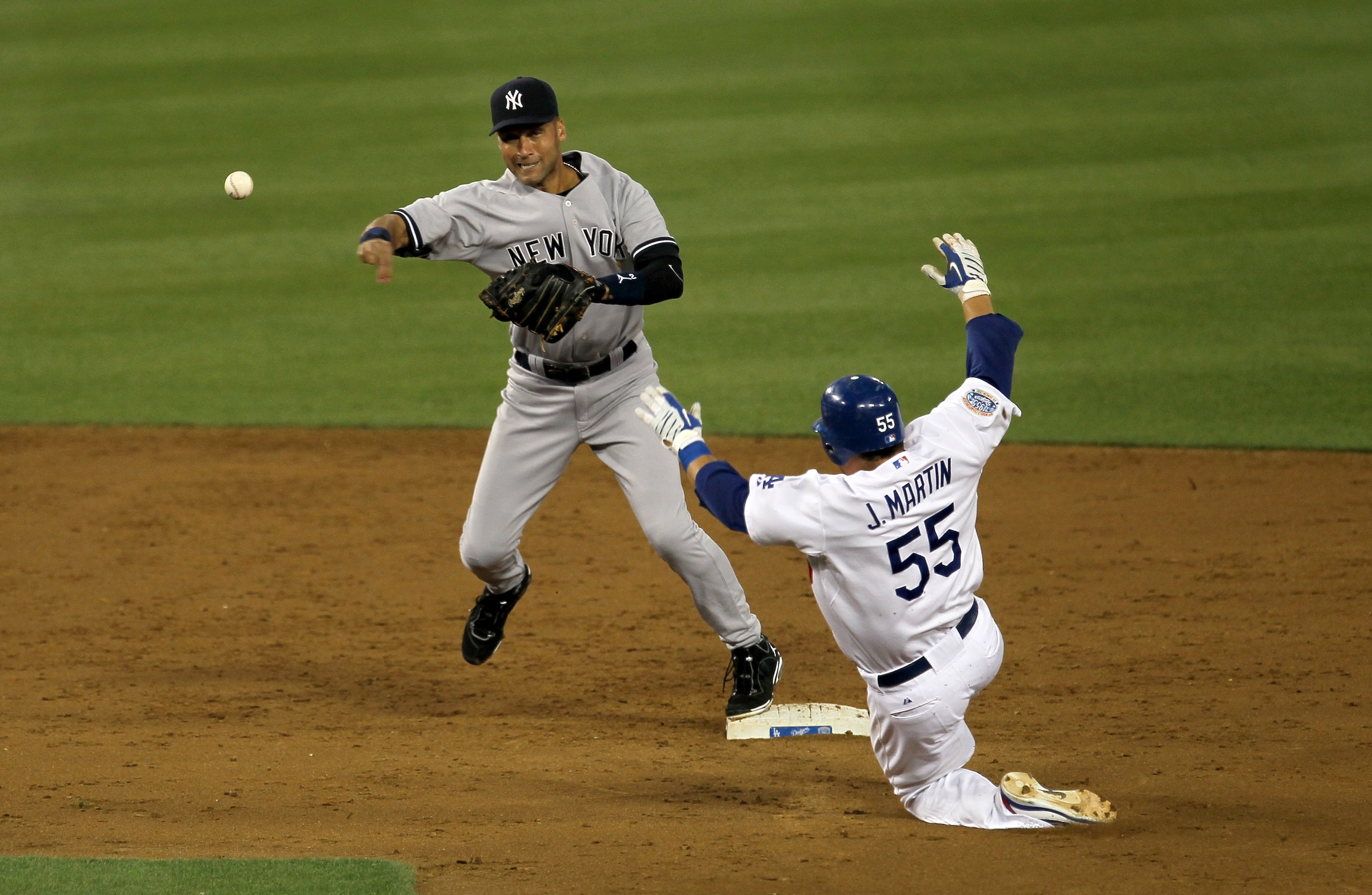 LOS ANGELES - JUNE 25: Shortstop Derek Jeter #2 of the New York Yankees throws to first after forcing out Russell Martin #55 of the Los Angeles Dodgers to complete a double play ending the third inning on June 25, 2010 at Dodger Stadium in Los Angeles, Ca