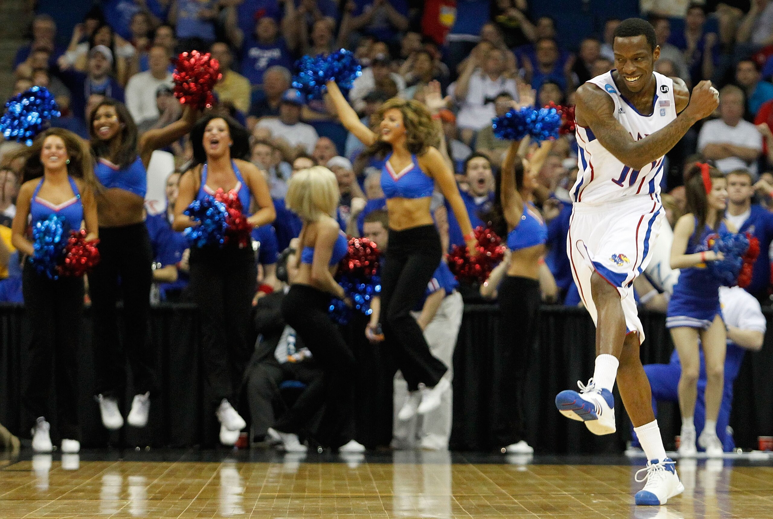 TULSA, OK - MARCH 20:  Tyshawn Taylor #10 of the Kansas Jayhawks reacts to a play during their 59-73 win over the Illinois Fighting Illini in the third round of the 2011 NCAA men's basketball tournament at BOK Center on March 20, 2011 in Tulsa, Oklahoma.
