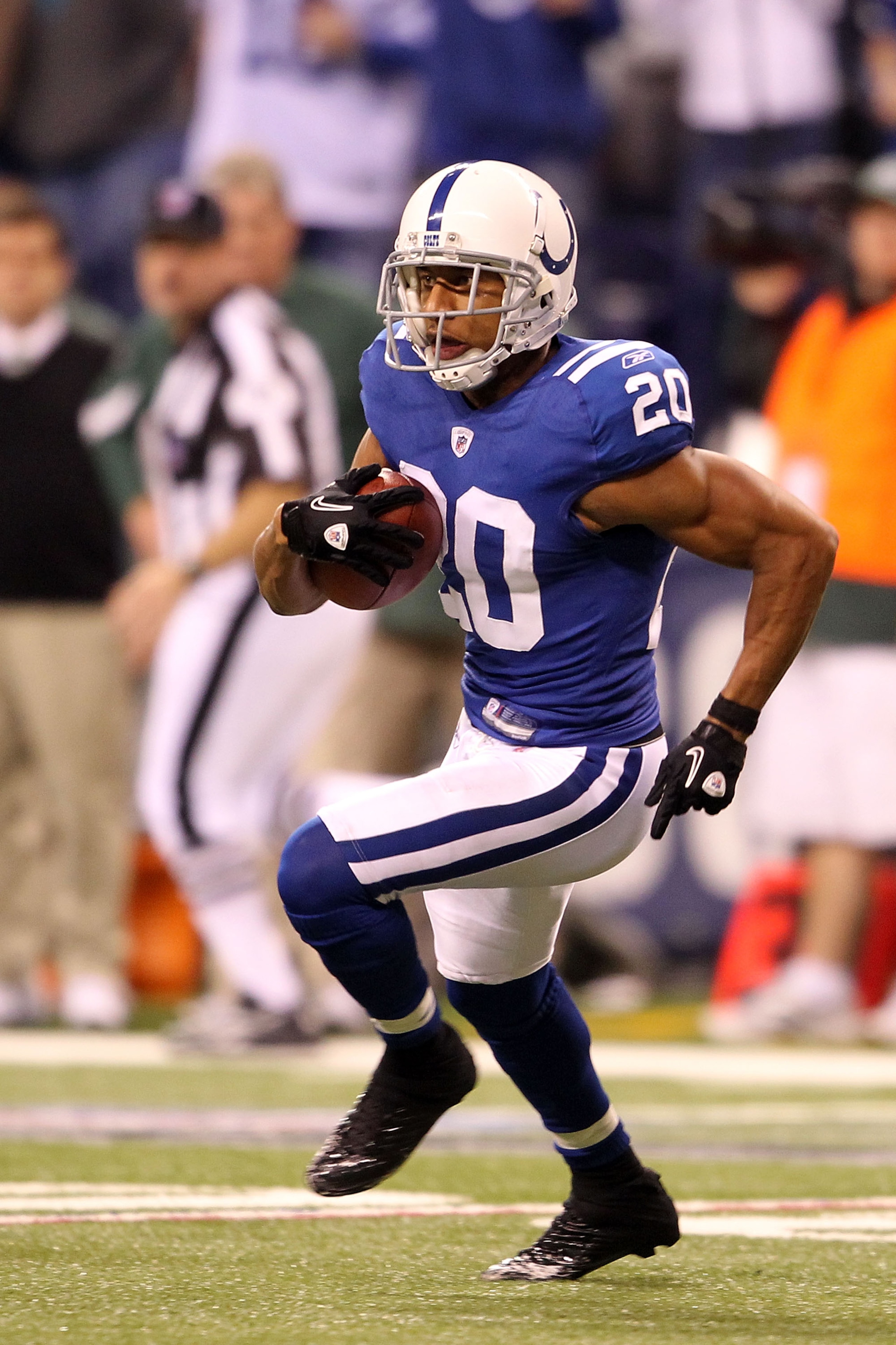 INDIANAPOLIS, IN - JANUARY 08:  Justin Tryon #20 of the Indianapolis Colts returns an interception for positive yards on a pass intended late in the second quarter against the New York Jets during their 2011 AFC wild card playoff game at Lucas Oil Stadium