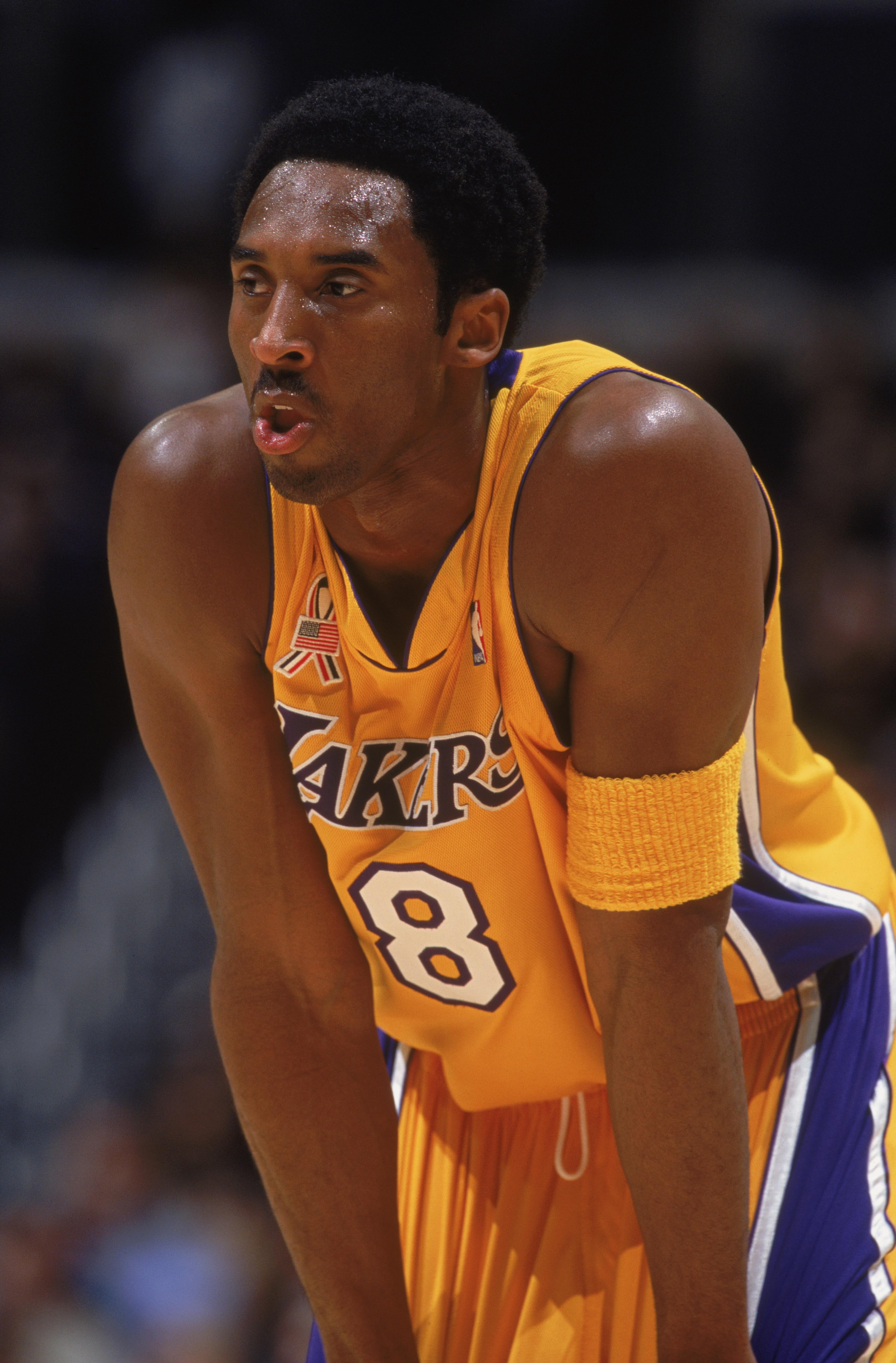11 Dec 2001:  Guard Kobe Bryant #8 of the Los Angeles Lakers rests during the NBA game against the Seattle SuperSonics at the Staples Center in Los Angeles, California.  The SuperSonics defeated the Lakers 104-93.Mandatory Credit: Jeff Gross /Getty Images