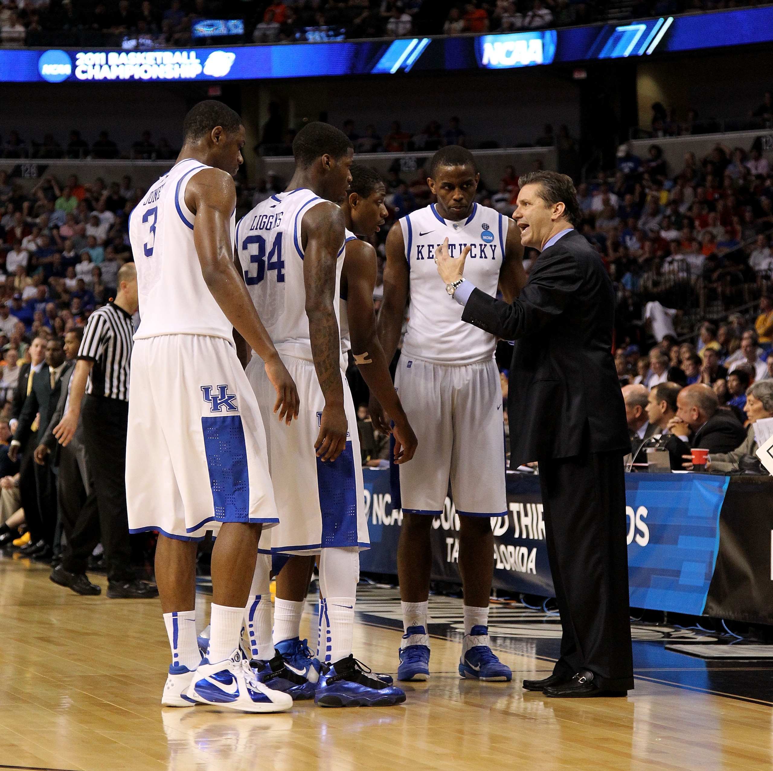 TAMPA, FL - MARCH 19:  head coach John Calipari of the Kentucky Wildcats talks with Terrence Jones #3, DeAndre Liggins #34, Brandon Knight #12 and Darius Miller #1 against the West Virginia Mountaineers during the third round of the 2011 NCAA men's basket