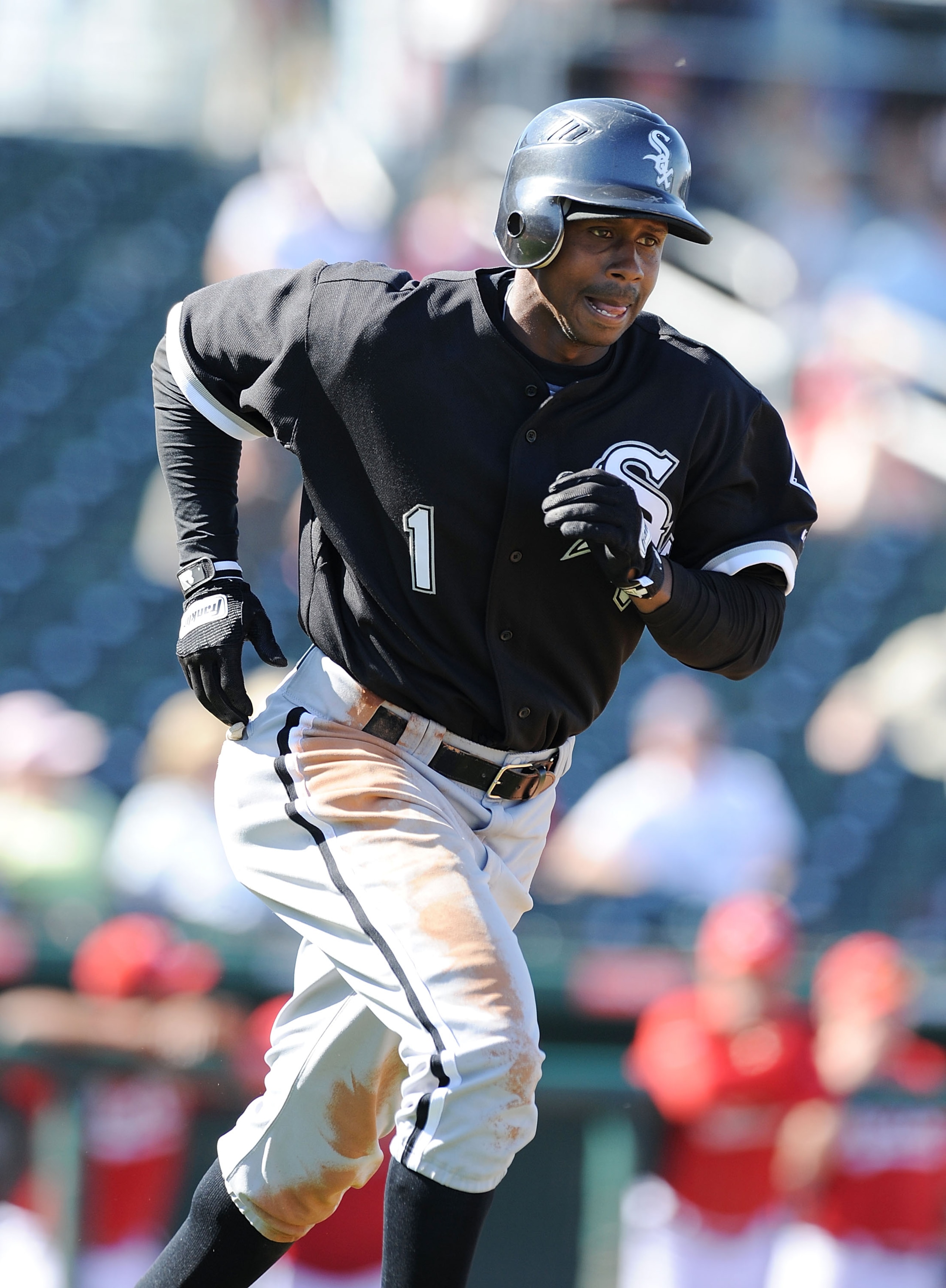 GOODYEAR, AZ - MARCH 02:  Juan Pierre #1 of the Chicago White Sox runs down to first base against the Cincinnati Reds during a spring training game at Goodyear Ballpark on March 2, 2011 in Goodyear, Arizona.  (Photo by Norm Hall/Getty Images)