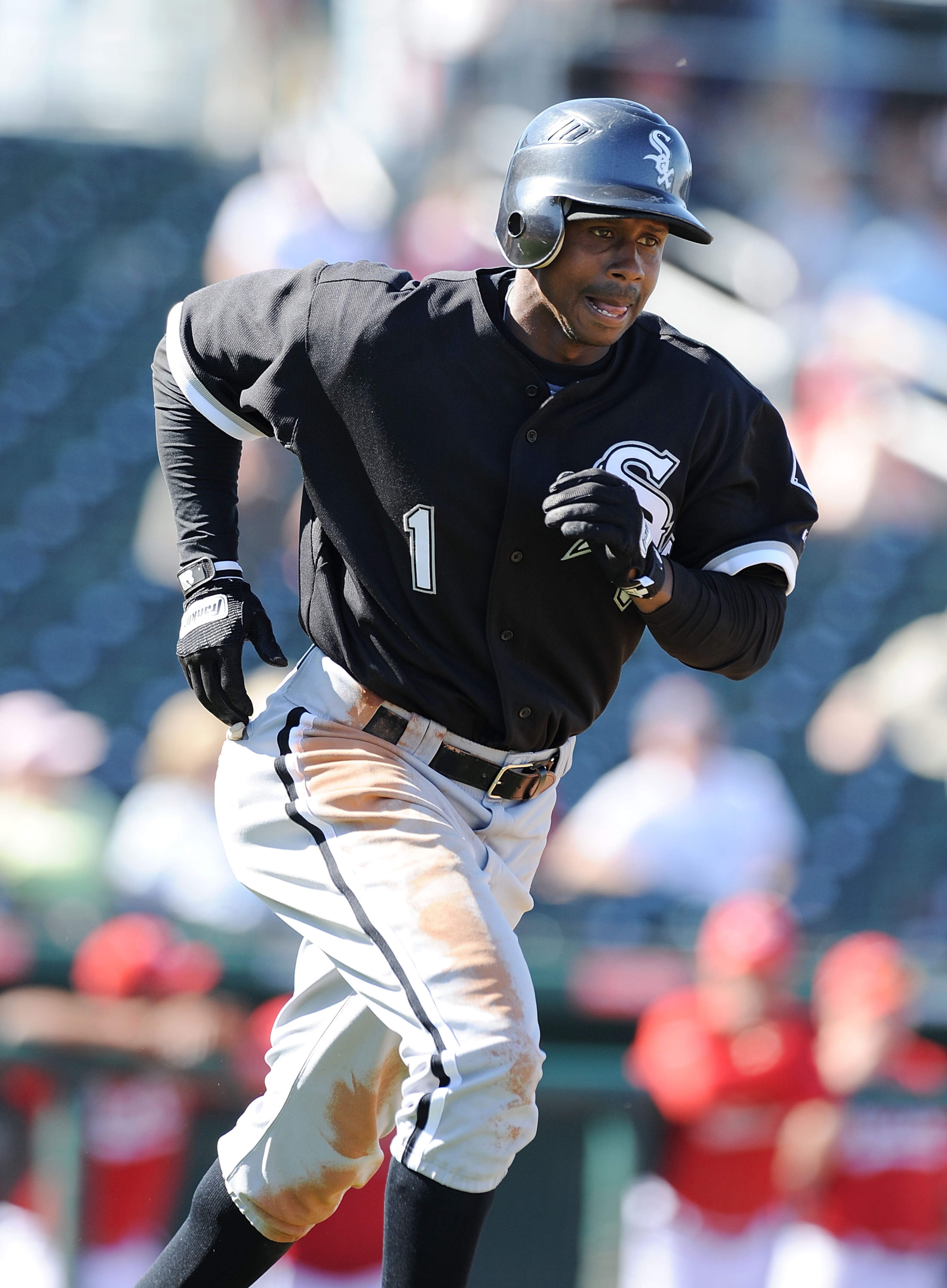 GOODYEAR, AZ - MARCH 02:  Juan Pierre #1 of the Chicago White Sox runs down to first base against the Cincinnati Reds during a spring training game at Goodyear Ballpark on March 2, 2011 in Goodyear, Arizona.  (Photo by Norm Hall/Getty Images)