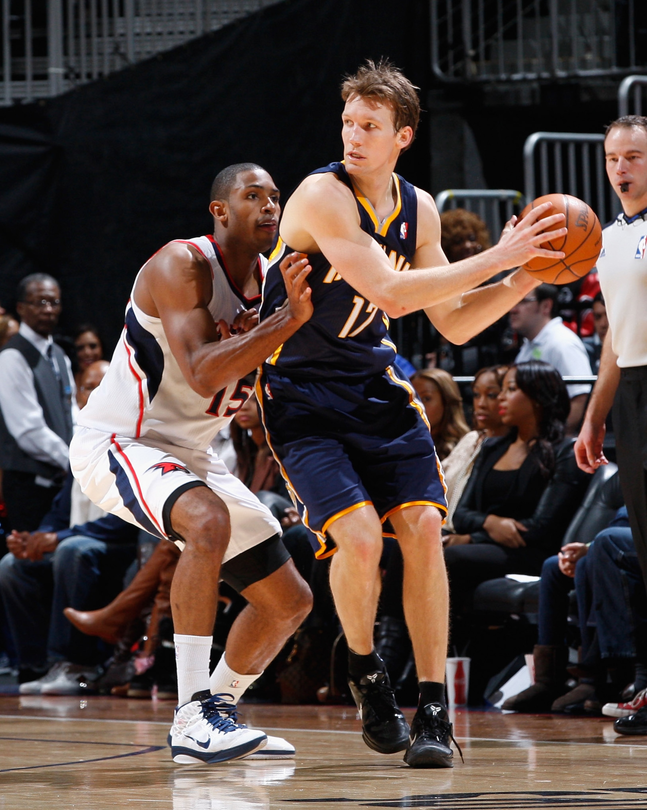 ATLANTA, GA - DECEMBER 11:  Mike Dunleavy #17 of the Indiana Pacers against Al Horford #15 of the Atlanta Hawks at Philips Arena on December 11, 2010 in Atlanta, Georgia.  NOTE TO USER: User expressly acknowledges and agrees that, by downloading and/or us