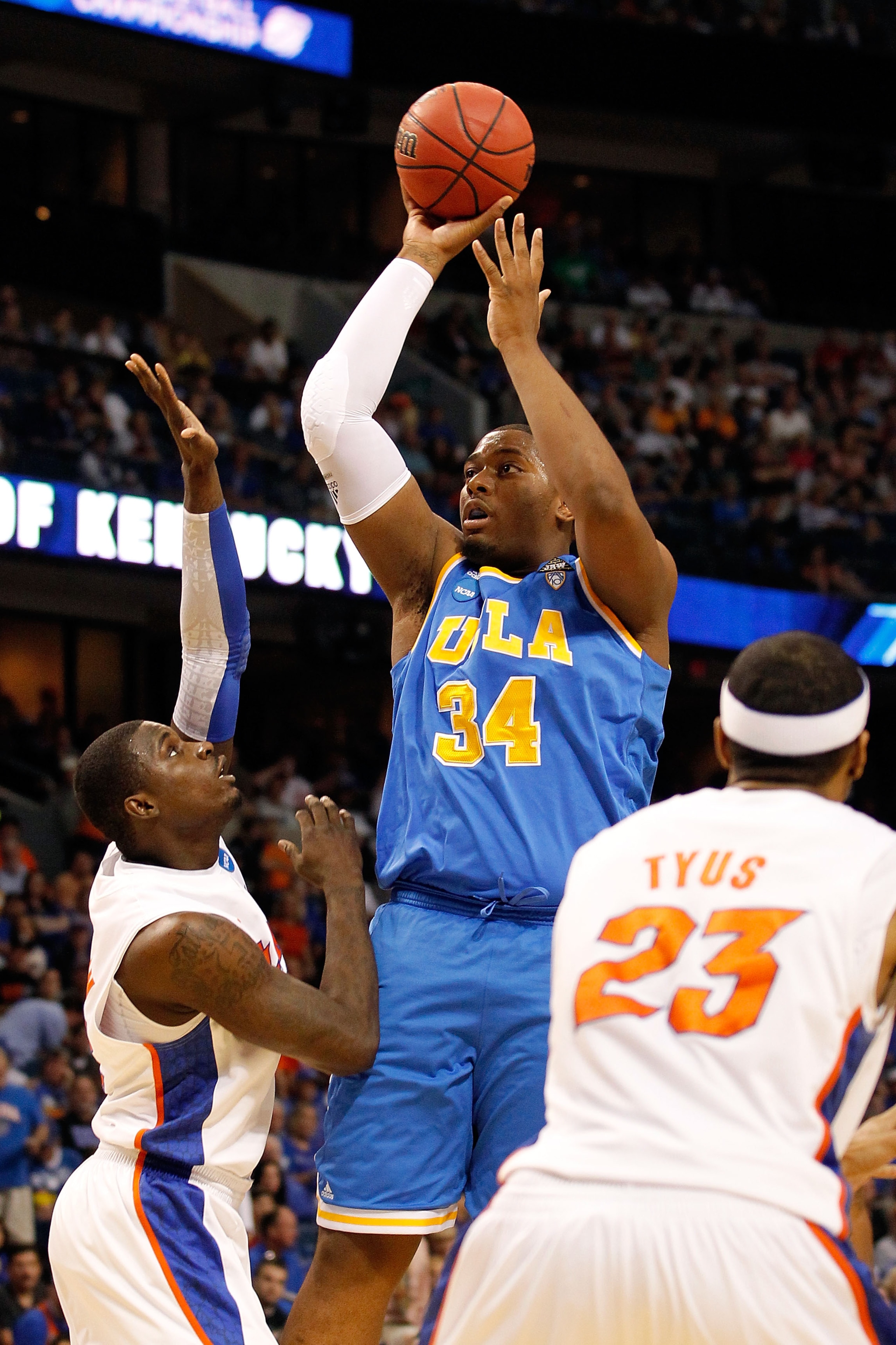 TAMPA, FL - MARCH 19:  Joshua Smith #34 of the UCLA Bruins attempts a shot in the first half against Vernon Macklin #32 of the Florida Gators during the third round of the 2011 NCAA men's basketball tournament at St. Pete Times Forum on March 19, 2011 in