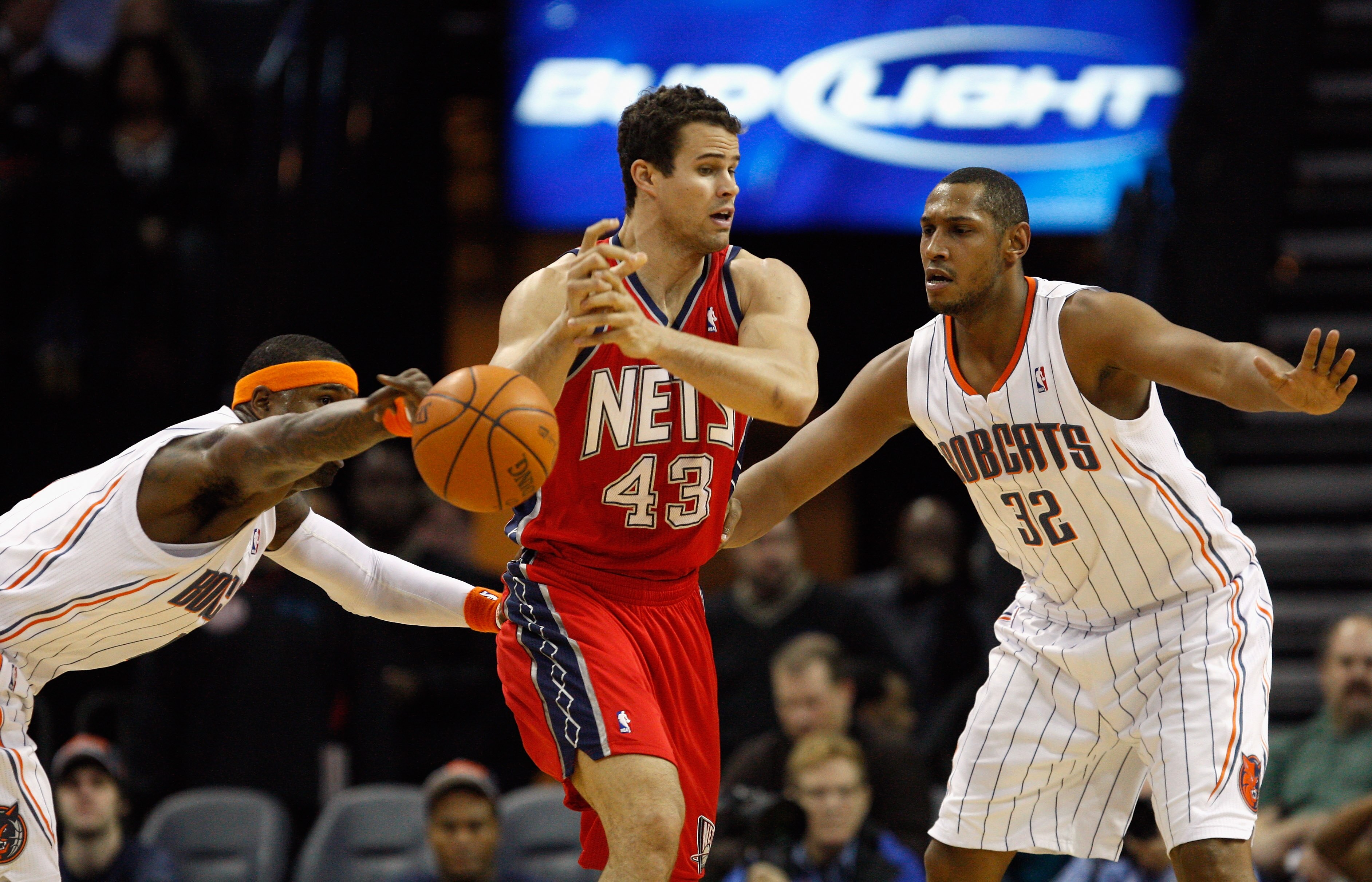 CHARLOTTE, NC - FEBRUARY 11:  Kris Humphries #43 of the New Jersey Nets has the ball knocked loose by Stephen Jackson #1 of the Charlotte Bobcats as teammate Boris Diaw #32 watches on during their game at Time Warner Cable Arena on February 11, 2011 in Ch