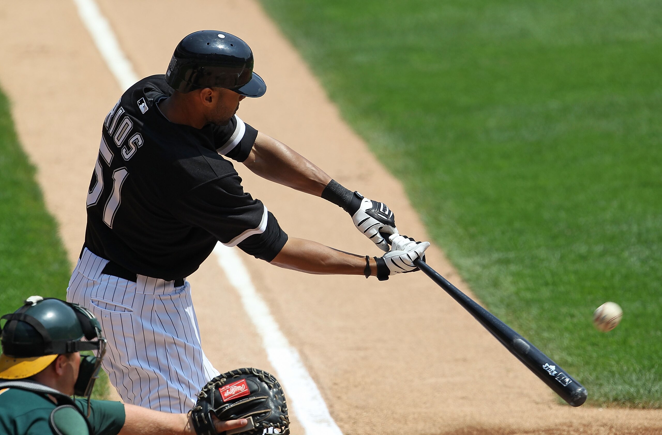 CHICAGO - AUGUST 01: Alex Rios #51 of the Chicago White Sox hits the ball against the Oakland Athletics at U.S. Cellular Field on August 1, 2010 in Chicago, Illinois. The White Sox defeated the Athletics 4-1. (Photo by Jonathan Daniel/Getty Images)