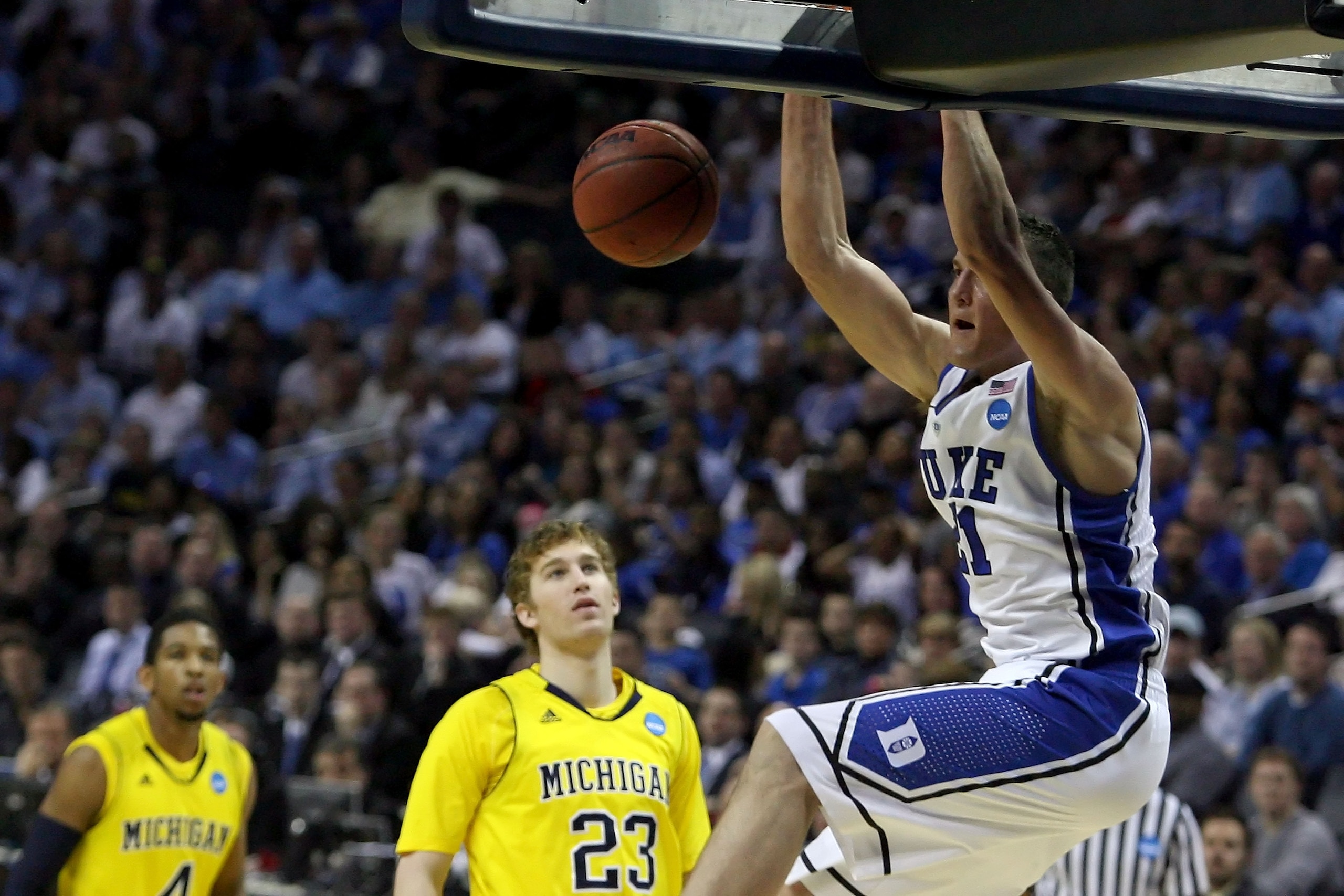 CHARLOTTE, NC - MARCH 20: Miles Plumlee #21 of the Duke Blue Devils dunks the ball in the first half while taking on the Michigan Wolverines during the third round of the 2011 NCAA men's basketball tournament at Time Warner Cable Arena on March 20, 2011 CHARLOTTE, NC - MARCH 20: Miles Plumlee #21 of the Duke Blue Devils dunks the ball in the first half while taking on the Michigan Wolverines during the third round of the 2011 NCAA men's basketball tournament at Time Warner Cable Arena on March 20, 2011