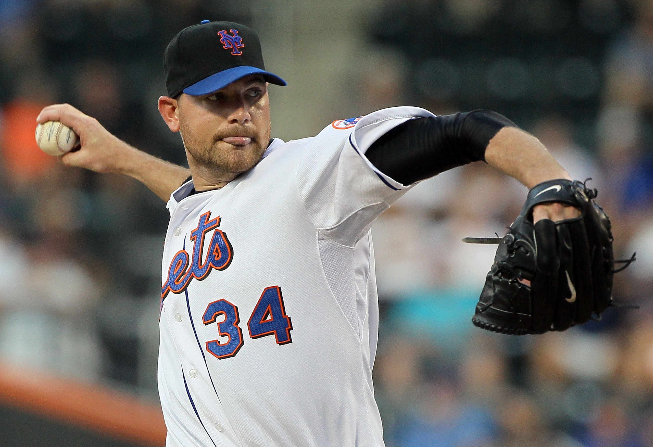 NEW YORK - JULY 05:  Mike Pelfrey #34 of the New York Mets delivers a pitch against the Cincinnati Reds on July 5, 2010 at Citi Field in the Flushing neighborhood of the Queens borough of New York City.  (Photo by Jim McIsaac/Getty Images)