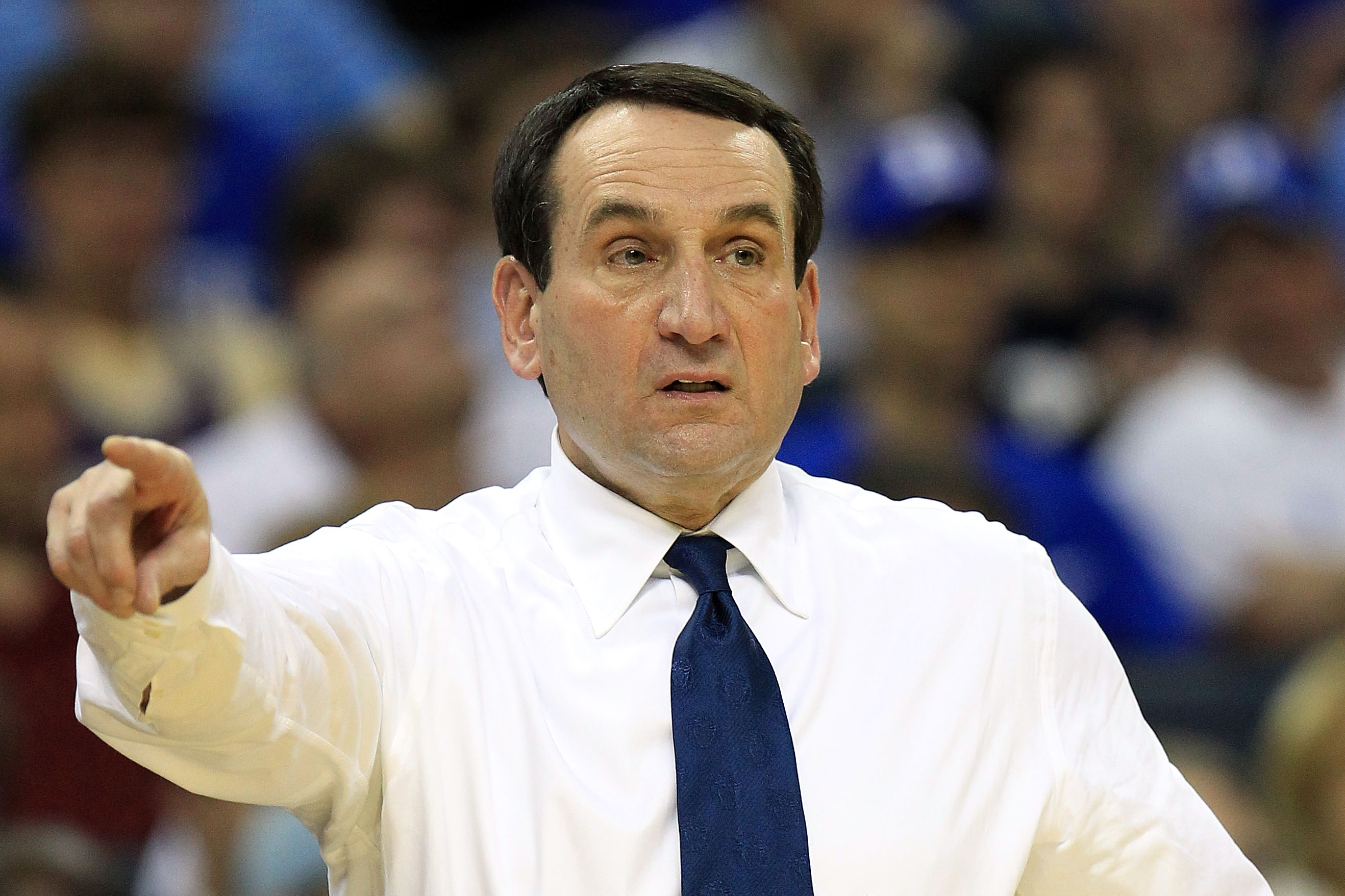 CHARLOTTE, NC - MARCH 20: Head coach Mike Krzyzewski of the Duke Blue Devils reacts while taking on the Michigan Wolverines during the third round of the 2011 NCAA men's basketball tournament at Time Warner Cable Arena on March 20, 2011 in Charlotte, Nor CHARLOTTE, NC - MARCH 20: Head coach Mike Krzyzewski of the Duke Blue Devils reacts while taking on the Michigan Wolverines during the third round of the 2011 NCAA men's basketball tournament at Time Warner Cable Arena on March 20, 2011 in Charlotte, Nor