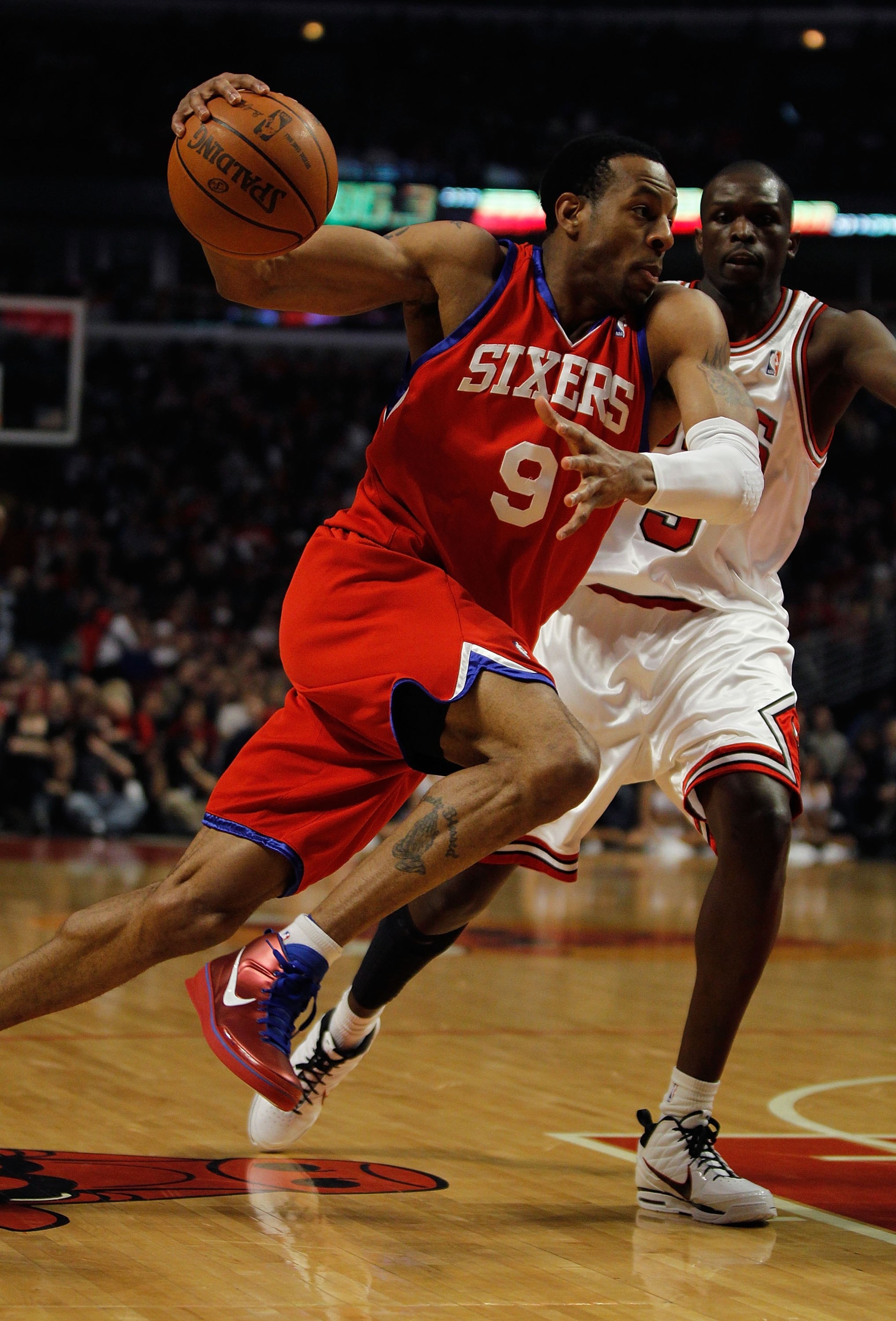 CHICAGO - FEBRUARY 20: Andre Iguodala #9 of the Philadelphia 76ers moves against Loul Deng #9 of the Chicago Bulls at the United Center on February 20, 2010 in Chicago, Illinois. The Bulls defeated the 76ers 122-90. NOTE TO USER: User expressly acknowledg