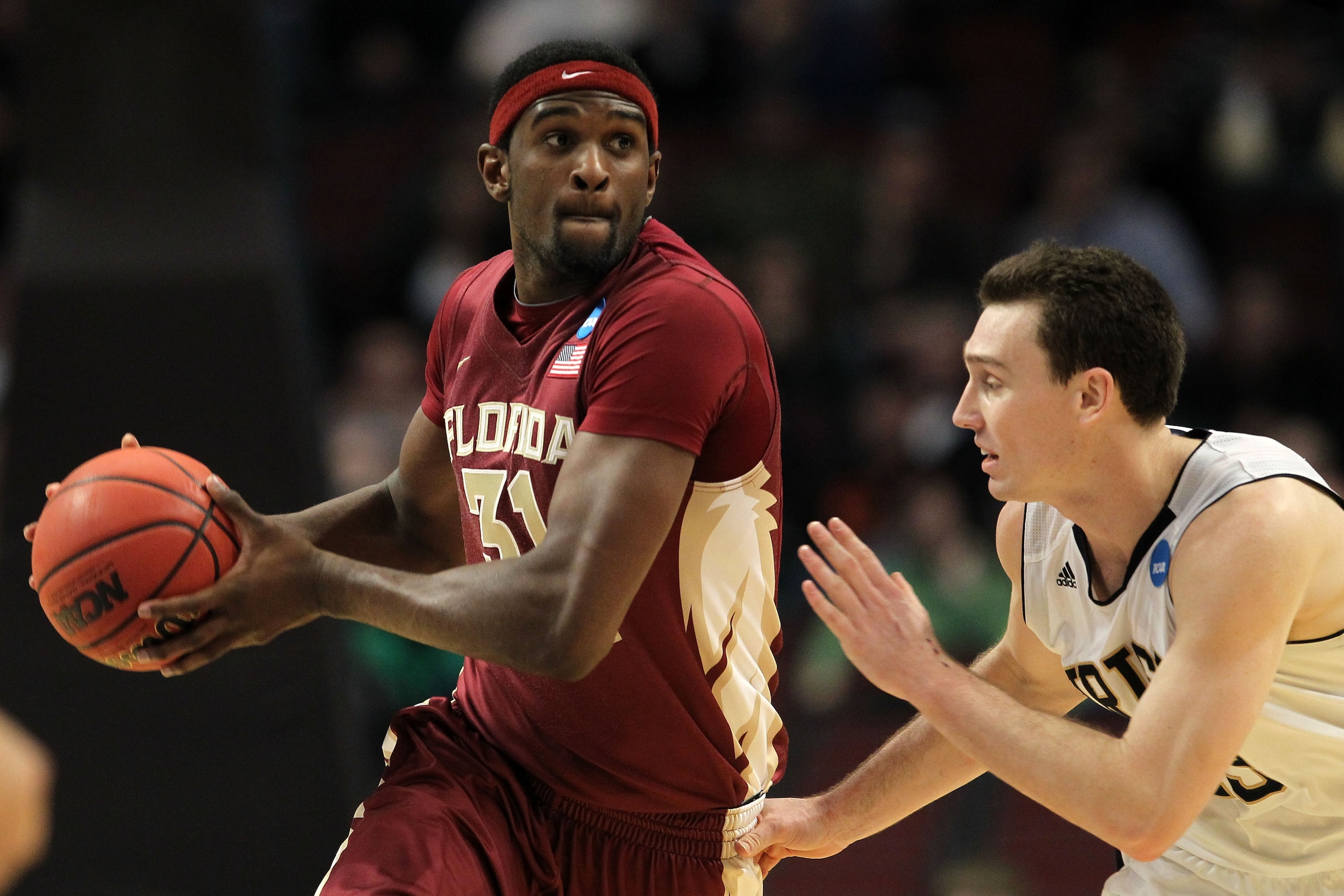 CHICAGO, IL - MARCH 20:  Chris Singleton #31 of the Florida State Seminoles drives against Ben Hansbrough #23 of the Notre Dame Fighting Irish in the second half during the third round of the 2011 NCAA men's basketball tournament at the United Center on M
