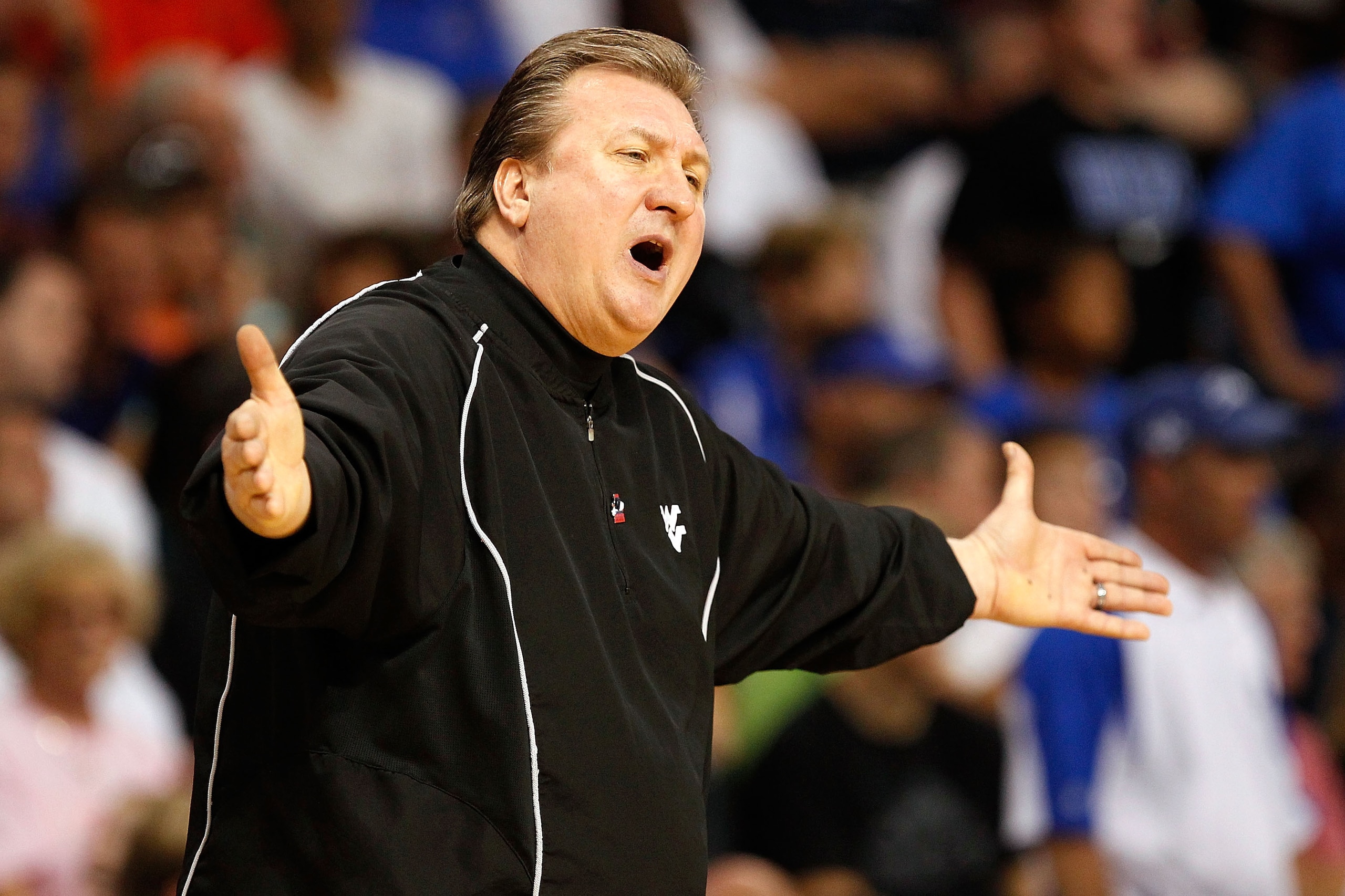 TAMPA, FL - MARCH 19:  Head coach Bob Huggins of the West Virginia Mountaineers reacts against the Kentucky Wildcats during the third round of the 2011 NCAA men's basketball tournament at St. Pete Times Forum on March 19, 2011 in Tampa, Florida.  (Photo b