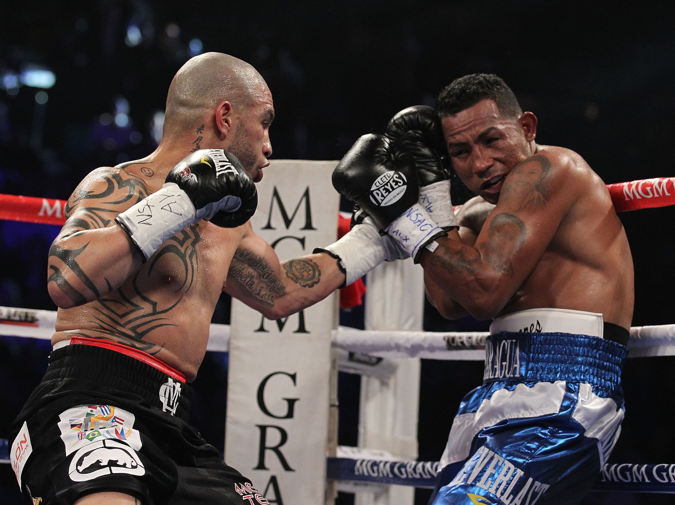 LAS VEGAS - MARCH 12:  Miguel Cotto punches Ricardo Mayorga during their WBA Super Welterweight title bout at the MGM Grand Garden Arena on March 12, 2011 in Las Vegas, Nevada.  (Photo by Al Bello/Getty Images)