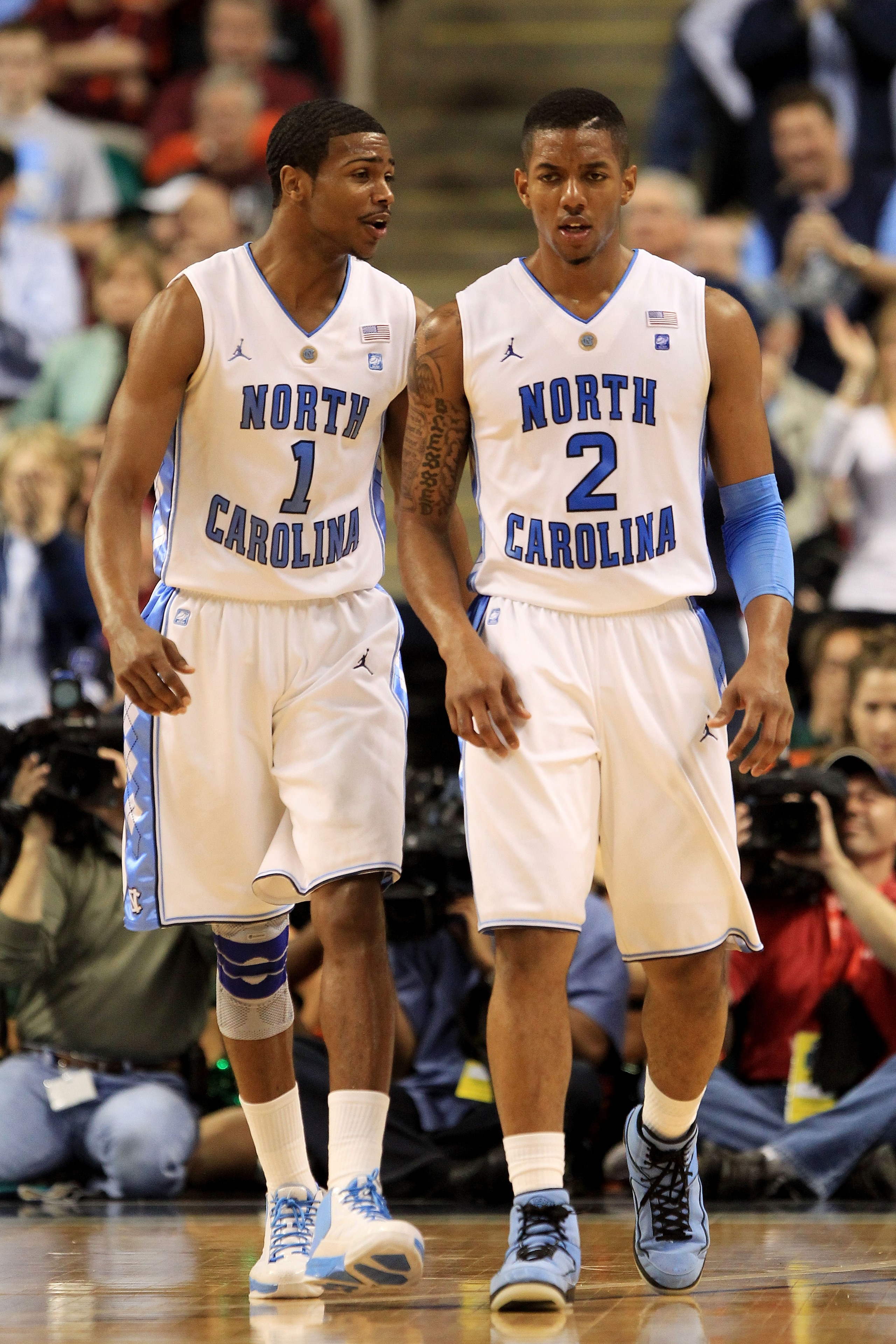 GREENSBORO, NC - MARCH 11:  Dexter Strickland #1 and Leslie McDonald #2 of the North Carolina Tar Heels look on during the second half of the game against the Miami Hurricanes in the quarterfinals of the 2011 ACC men's basketball tournament at the Greensb