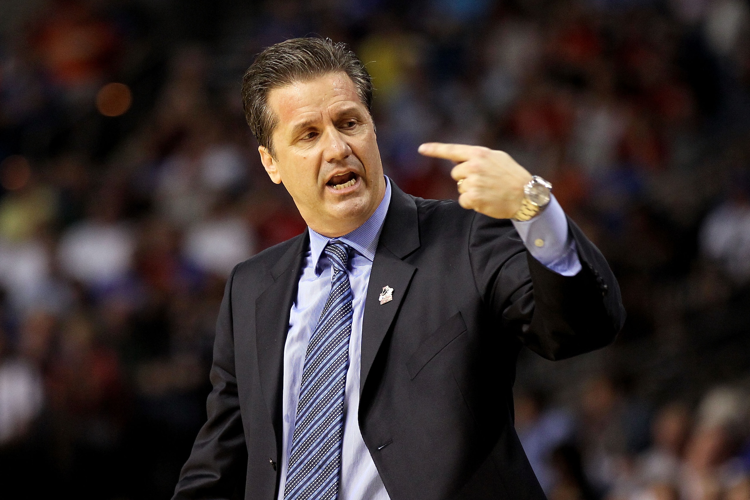 TAMPA, FL - MARCH 19:  head coach John Calipari of the Kentucky Wildcats gestures as he looks on against the West Virginia Mountaineers during the third round of the 2011 NCAA men's basketball tournament at St. Pete Times Forum on March 19, 2011 in Tampa,