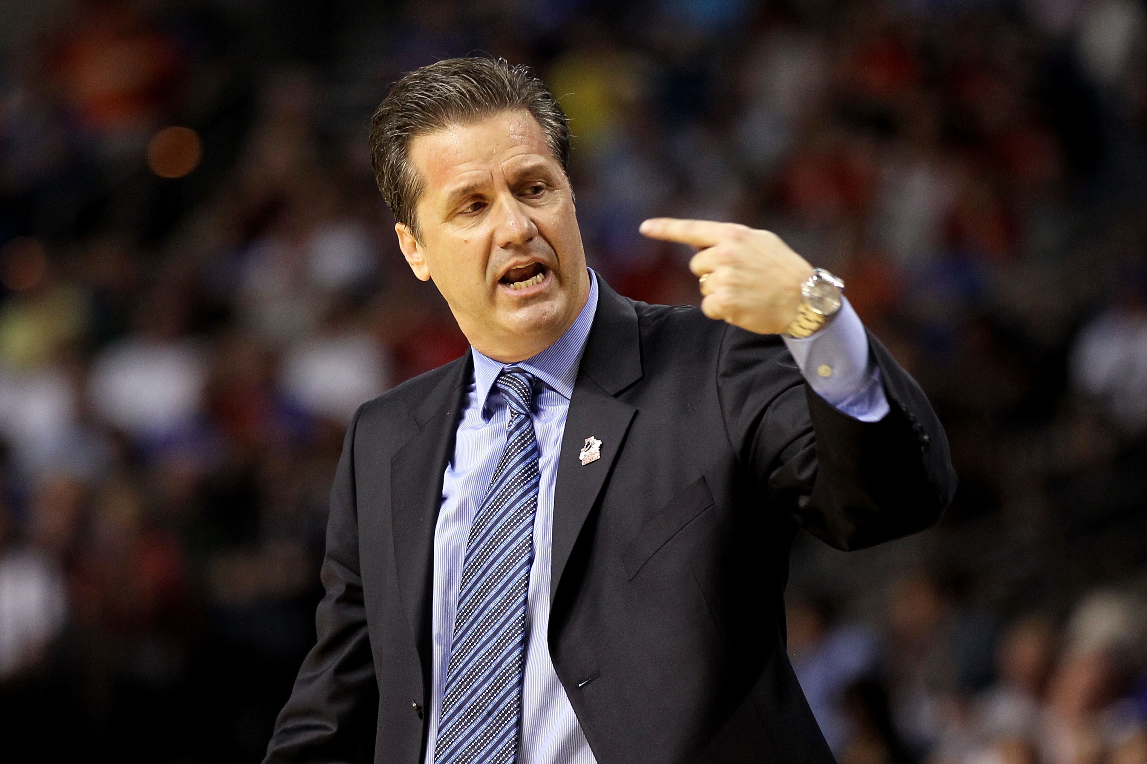 TAMPA, FL - MARCH 19:  head coach John Calipari of the Kentucky Wildcats gestures as he looks on against the West Virginia Mountaineers during the third round of the 2011 NCAA men's basketball tournament at St. Pete Times Forum on March 19, 2011 in Tampa,