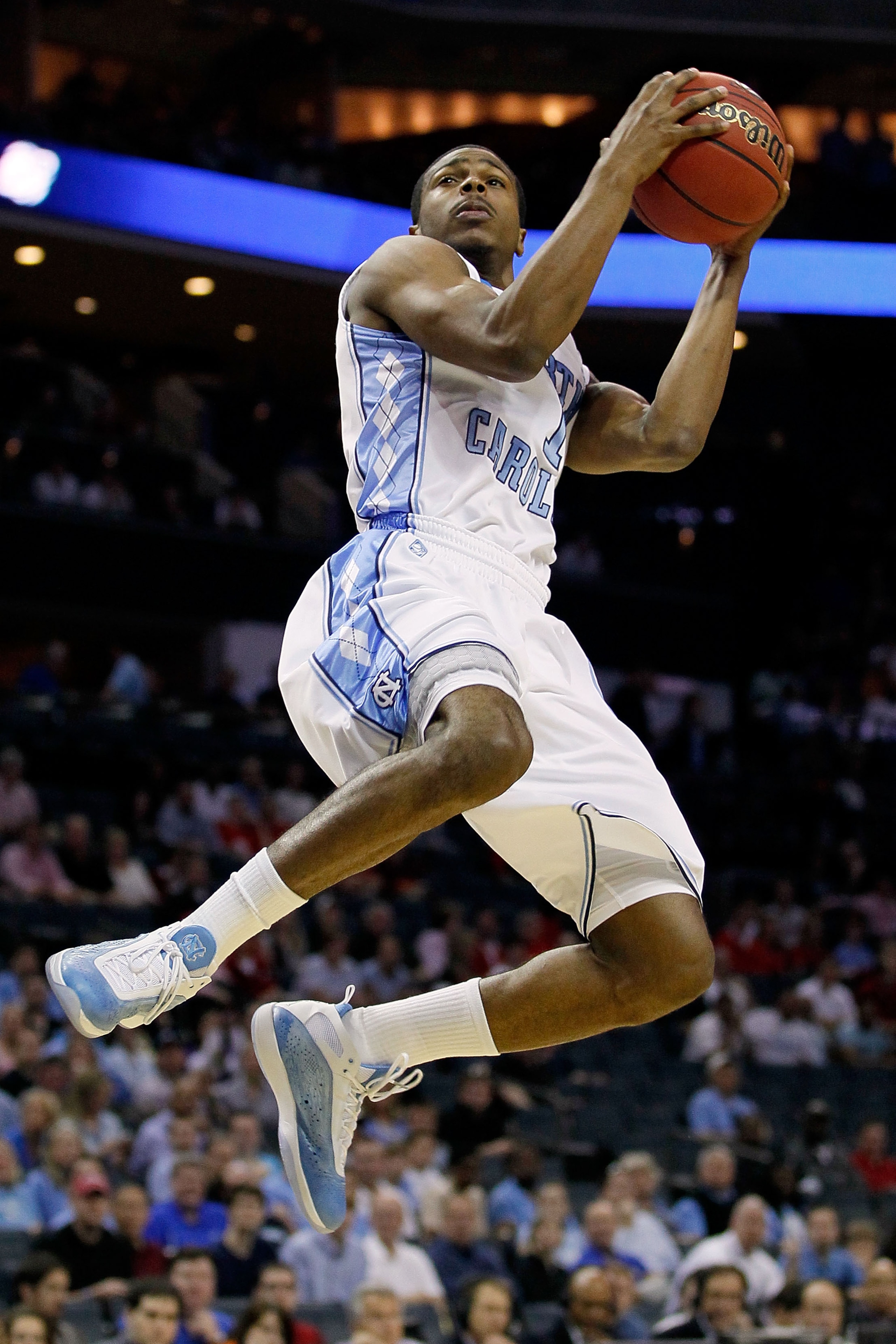 CHARLOTTE, NC - MARCH 18:  Dexter Strickland #1 of the North Carolina Tar Heels lays the ball up while taking on the Long Island Blackbirds in the first half during the second round of the 2011 NCAA men's basketball tournament at Time Warner Cable Arena o