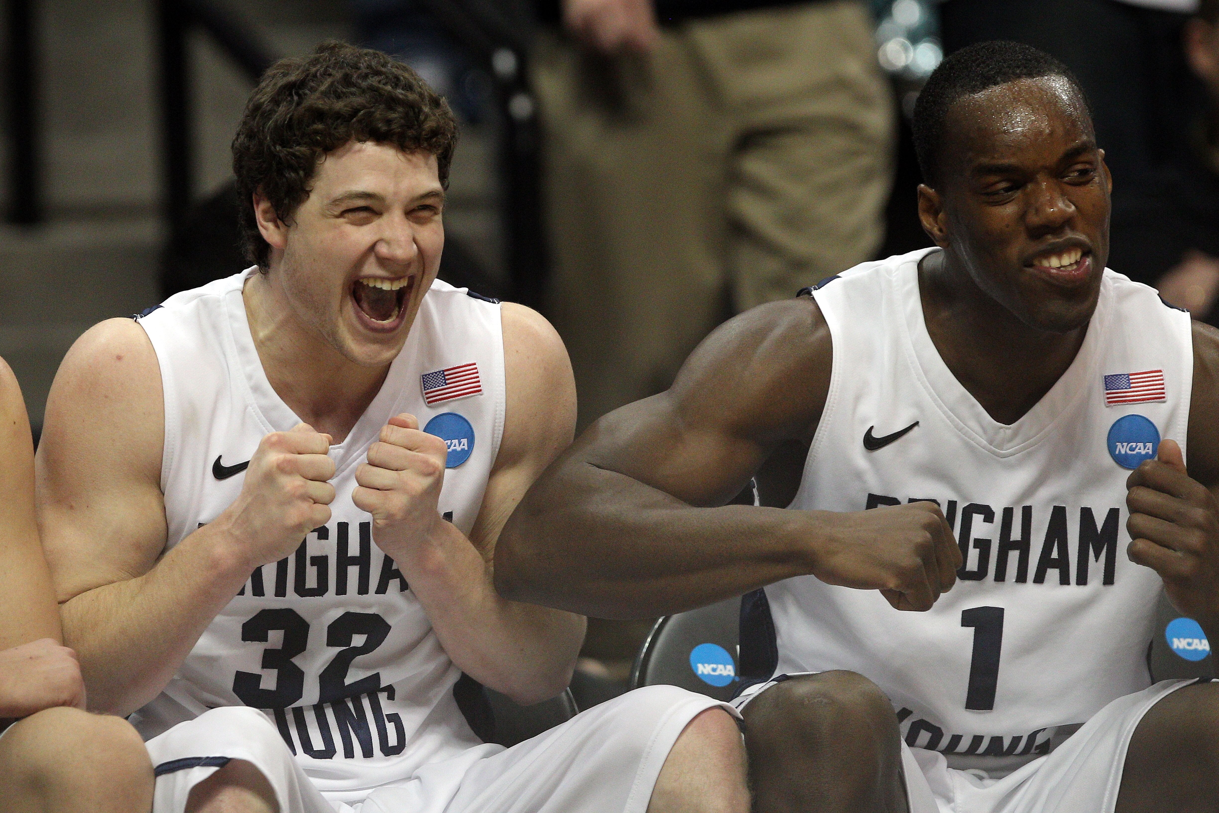 DENVER, CO - MARCH 19:  Jimmer Fredette #32 and Charles Abouo #1 of the Brigham Young Cougars celebrates on the bench towards the end of the game against the Gonzaga Bulldogs during the third round of the 2011 NCAA men's basketball tournament at Pepsi Cen