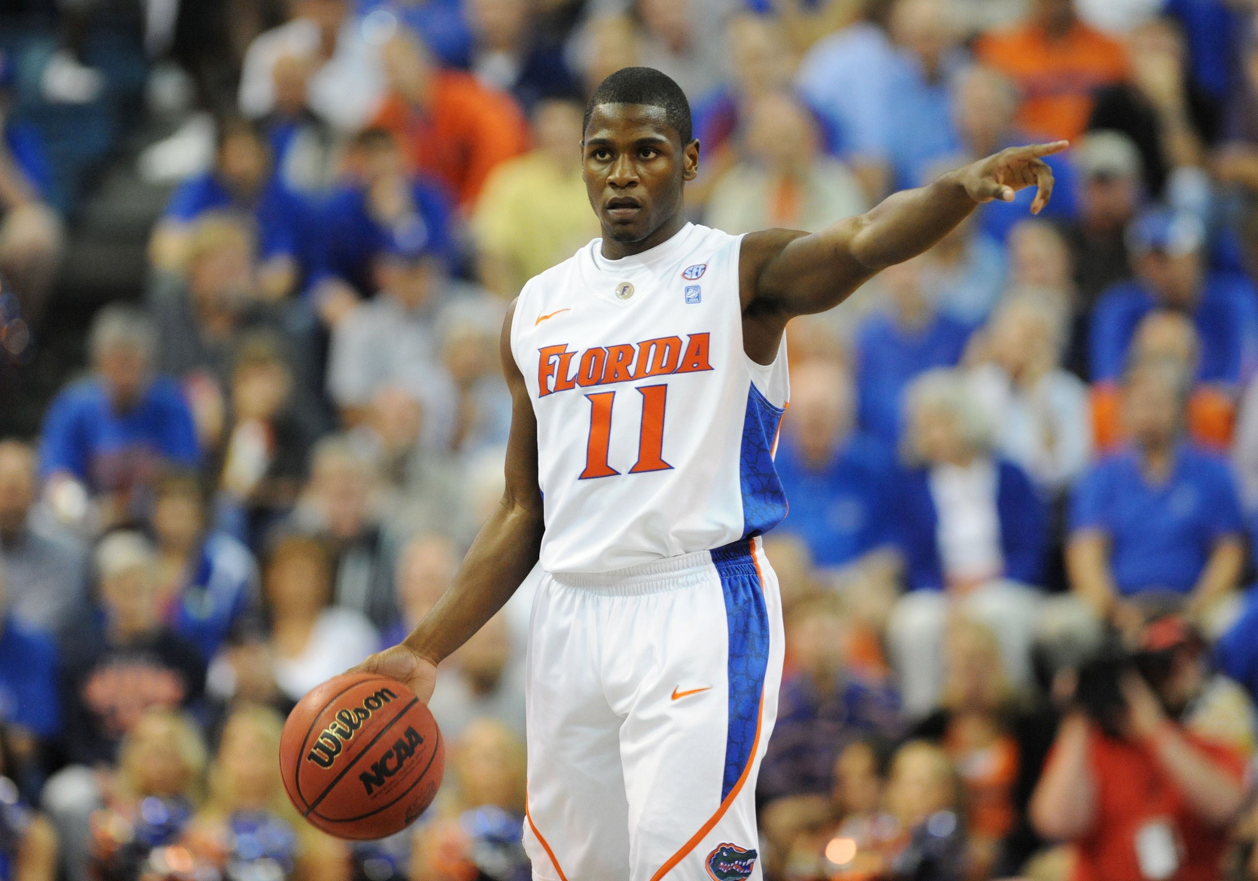 GAINESVILLE, FL - NOVEMBER 16: Guard Erving Walker #11 of the Florida Gators directs play against the Ohio State Buckeyes November 16, 2010 at the Stephen C. O'Connell Center in Gainesville, Florida.  (Photo by Al Messerschmidt/Getty Images)