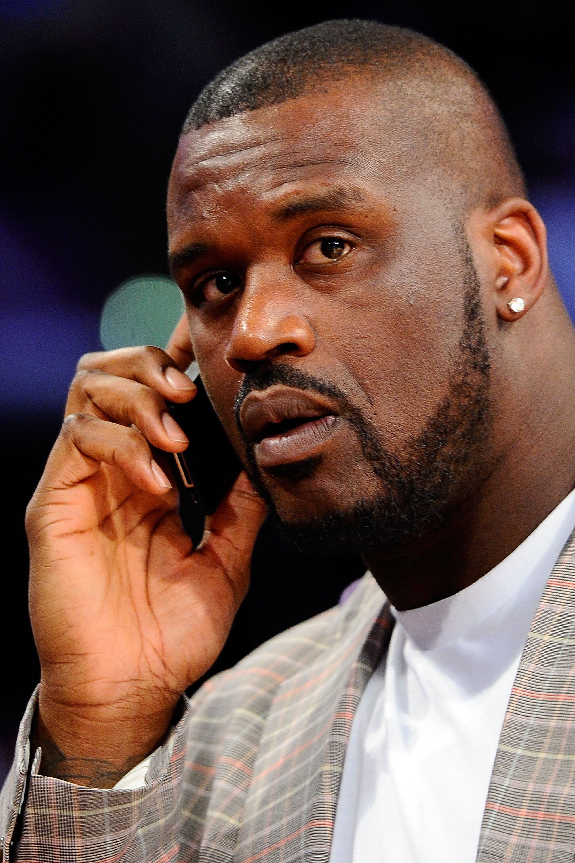 LOS ANGELES, CA - FEBRUARY 19:  Shaquille O'Neal of the Boston Celtics talks on the phone as he attends NBA All-Star Saturday night presented by State Farm at Staples Center on February 19, 2011 in Los Angeles, California.  (Photo by Kevork Djansezian/Get