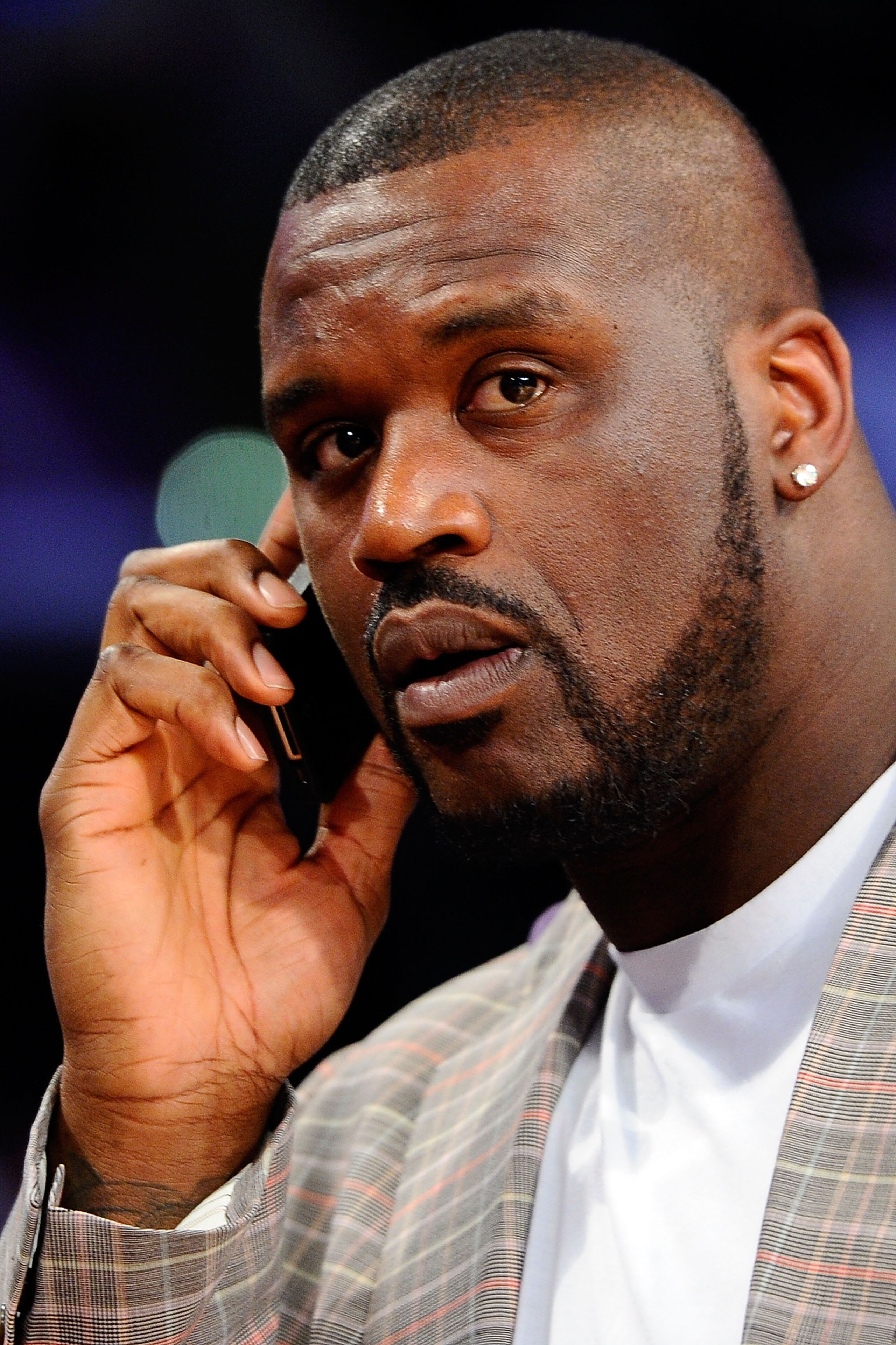 LOS ANGELES, CA - FEBRUARY 19:  Shaquille O'Neal of the Boston Celtics talks on the phone as he attends NBA All-Star Saturday night presented by State Farm at Staples Center on February 19, 2011 in Los Angeles, California.  (Photo by Kevork Djansezian/Get