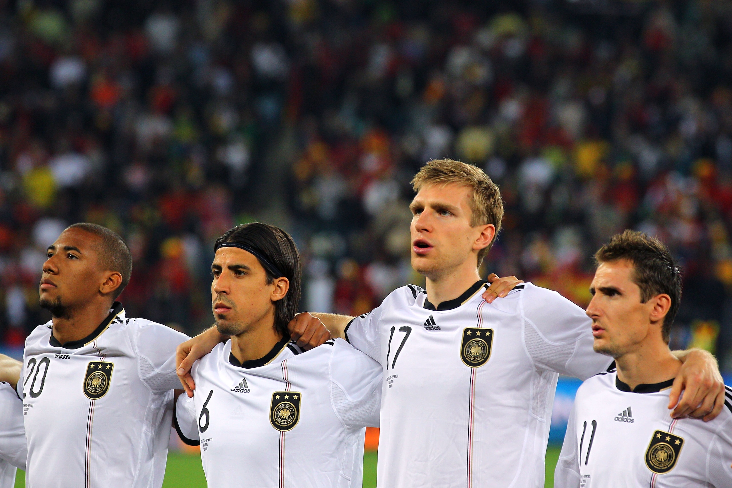 DURBAN, SOUTH AFRICA - JULY 07:  Jerome Boateng, Sami Khedira, Per Mertesacker and Miroslav Klose of Germany sing their national anthem ahead of the 2010 FIFA World Cup South Africa Semi Final match between Germany and Spain at Durban Stadium on July 7, 2