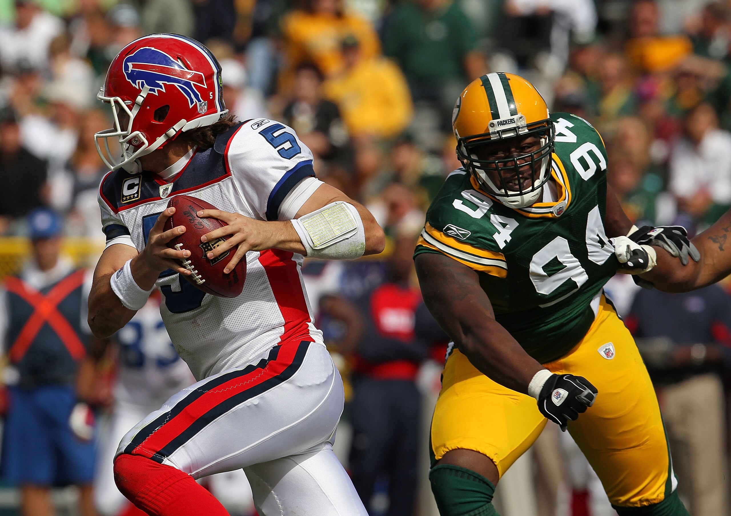 GREEN BAY, WI - SEPTEMBER 19: Trent Edwards #5 of the Buffalo Bills runs past Jarius Wynn #94 of the Green Bay Packers at Lambeau Field on September 19, 2010 in Green Bay, Wisconsin. The Packers defeated the Bills 34-7. (Photo by Jonathan Daniel/Getty Ima