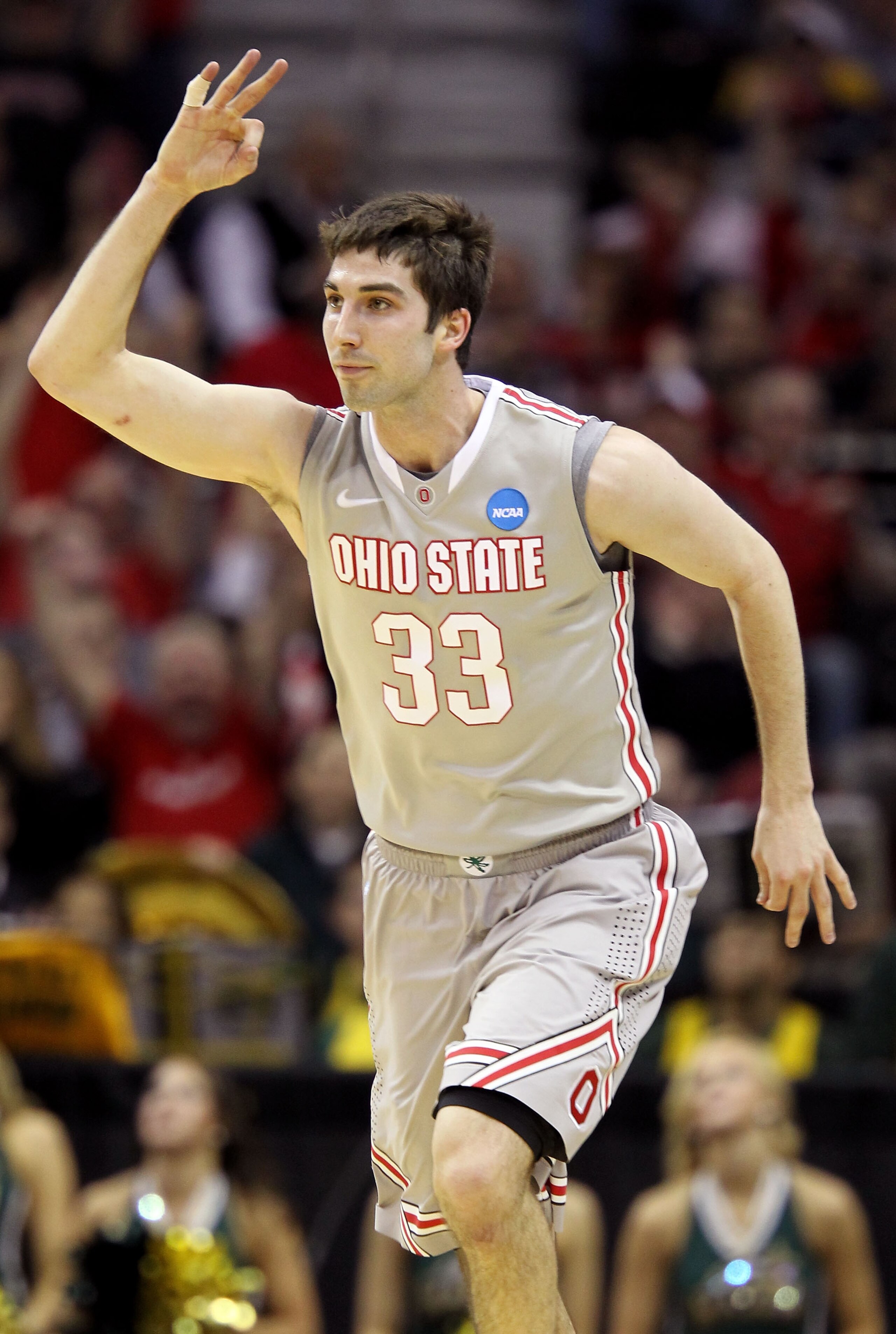 CLEVELAND, OH - MARCH 20:  Jon Diebler #33 of the Ohio State Buckeyes celebrates after making a three pointer at the end of the first half against the George Mason Patriots during the third of the 2011 NCAA men's basketball tournament at Quicken Loans Are