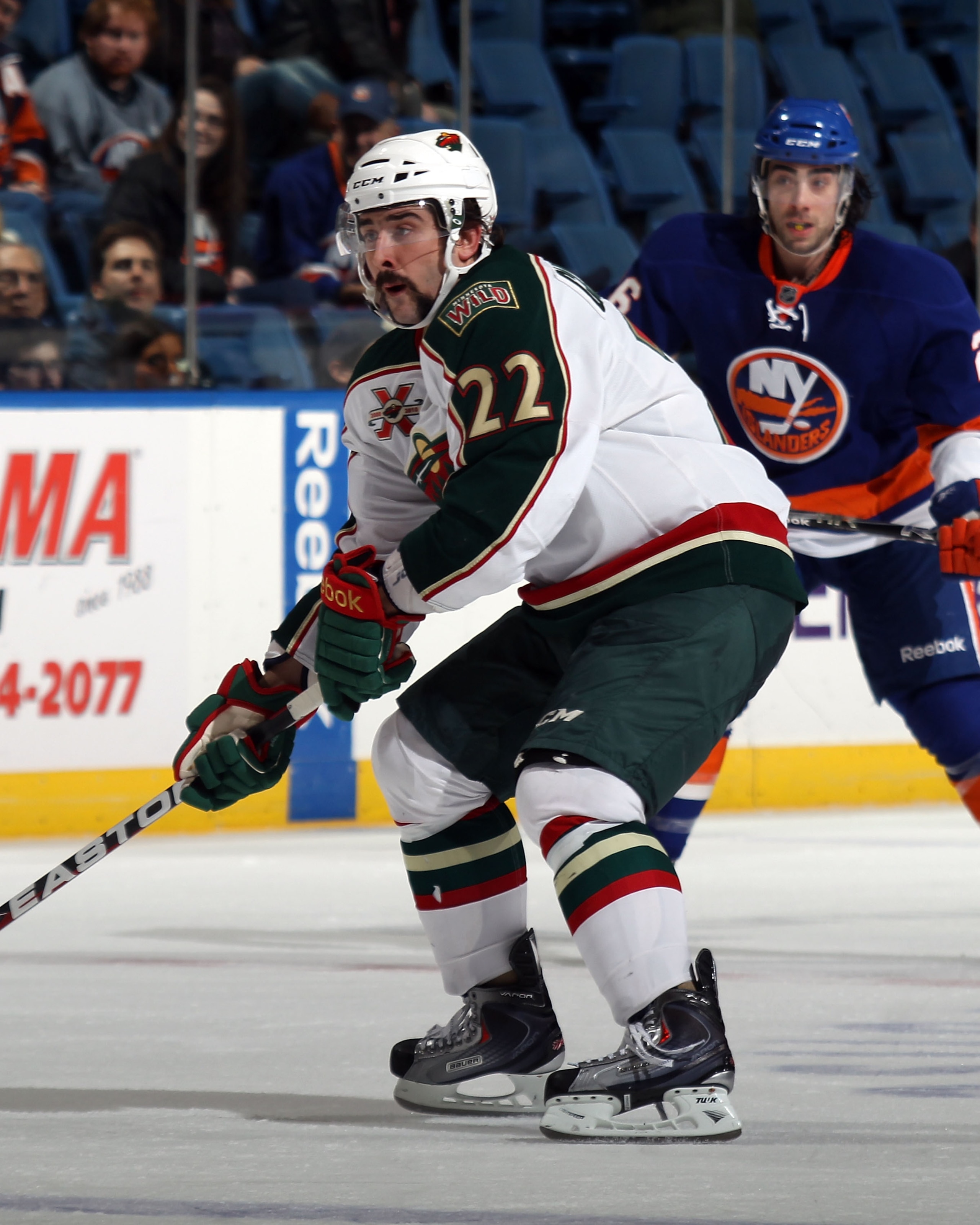 UNIONDALE, NY - MARCH 02:  Cal Clutterbuck #22 of the Minnesota Wild skates against the New York Islanders at the Nassau Coliseum on March 2, 2011 in Uniondale, New York. The Islanders defeated the Wild 4-1.  (Photo by Bruce Bennett/Getty Images)