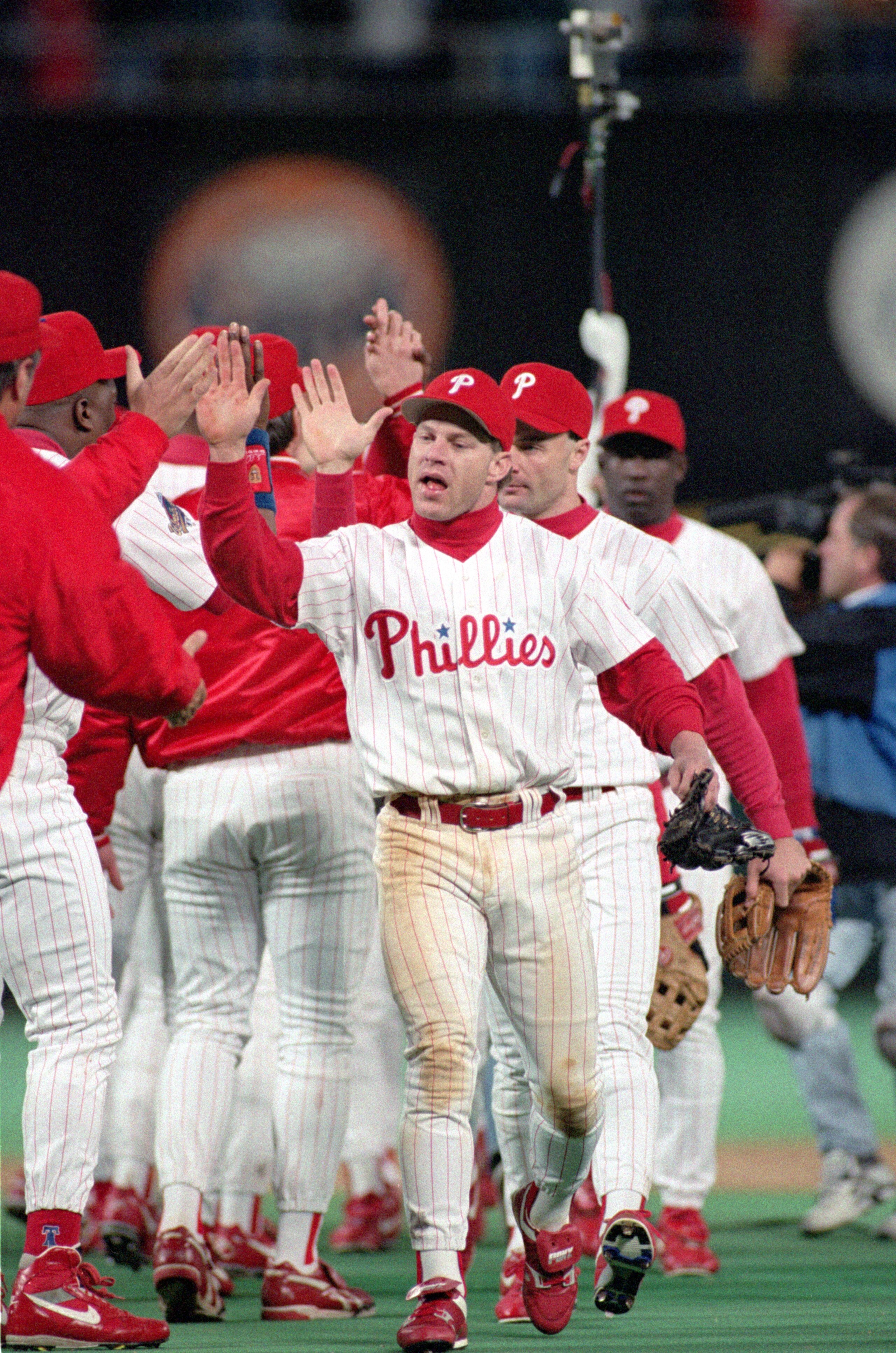 PHILADELPHIA - OCTOBER 21: Lenny Dykstra #4 of the Philadelphia Phillies high fives teammates following Game five of the 1993 World Series against the Toronto Blue Jays at Veterans Stadium on October 21, 1993 in Philadelphia, Pennsylvania. The Phillies d PHILADELPHIA - OCTOBER 21: Lenny Dykstra #4 of the Philadelphia Phillies high fives teammates following Game five of the 1993 World Series against the Toronto Blue Jays at Veterans Stadium on October 21, 1993 in Philadelphia, Pennsylvania. The Phillies d