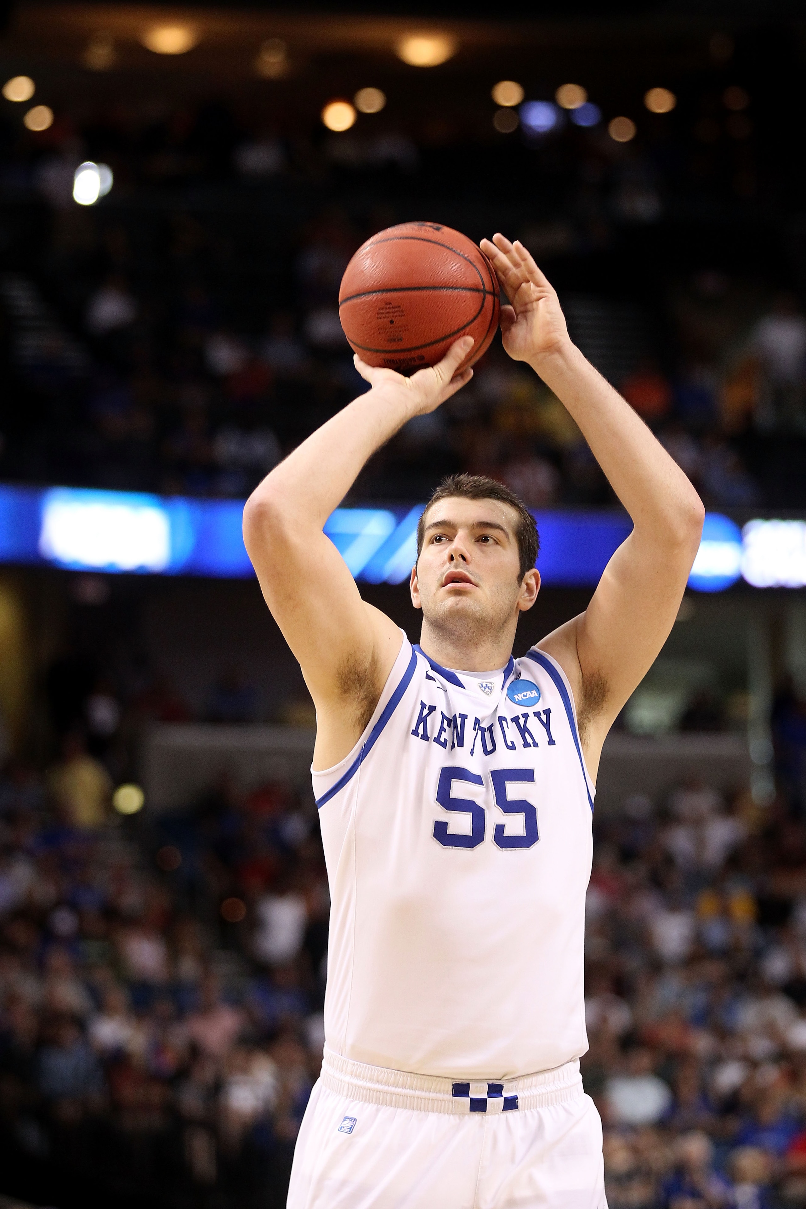 TAMPA, FL - MARCH 19:  Josh Harrellson #55 of the Kentucky Wildcats shoots a free throw attempt against the West Virginia Mountaineers during the third round of the 2011 NCAA men's basketball tournament at St. Pete Times Forum on March 19, 2011 in Tampa,