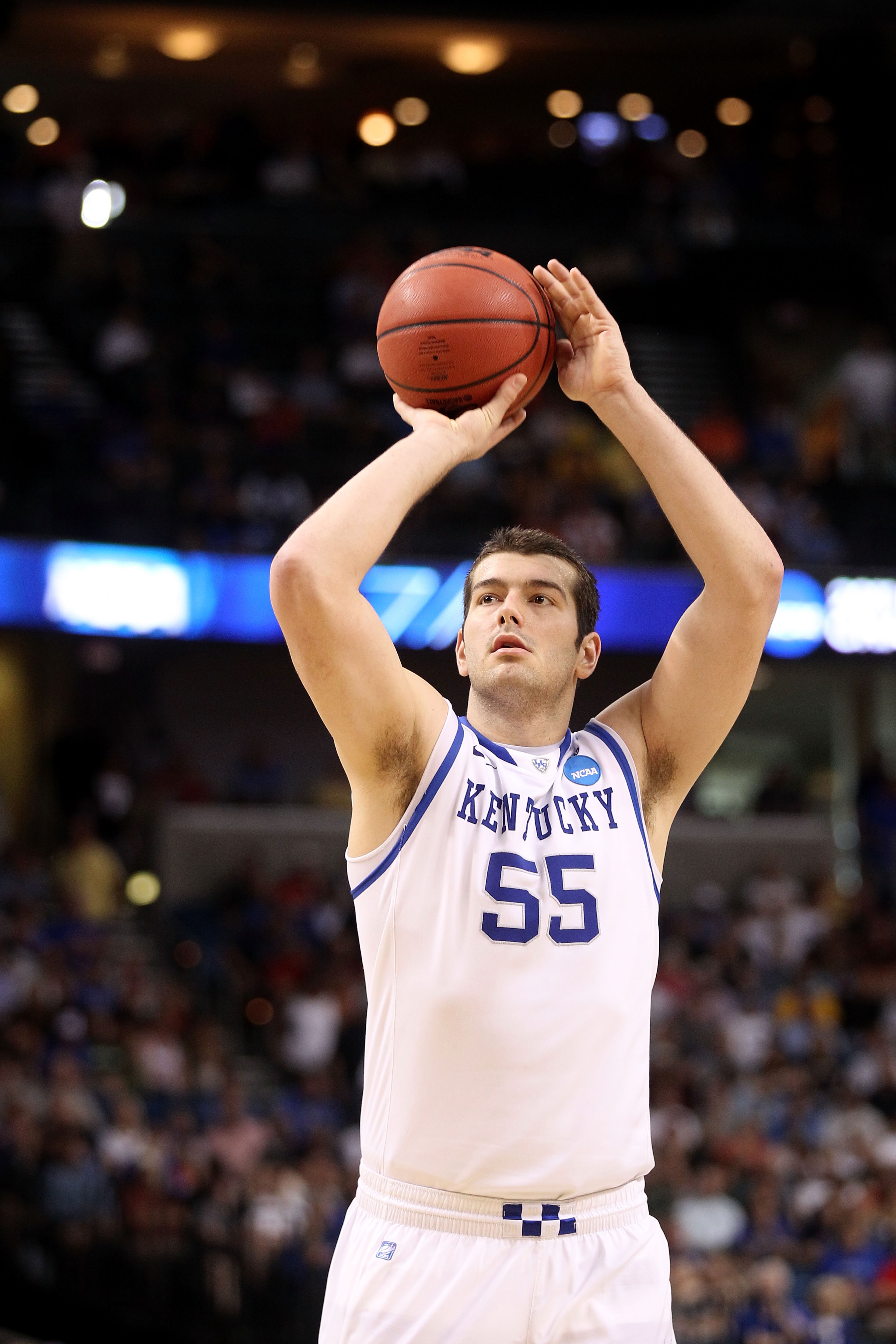 TAMPA, FL - MARCH 19:  Josh Harrellson #55 of the Kentucky Wildcats shoots a free throw attempt against the West Virginia Mountaineers during the third round of the 2011 NCAA men's basketball tournament at St. Pete Times Forum on March 19, 2011 in Tampa,
