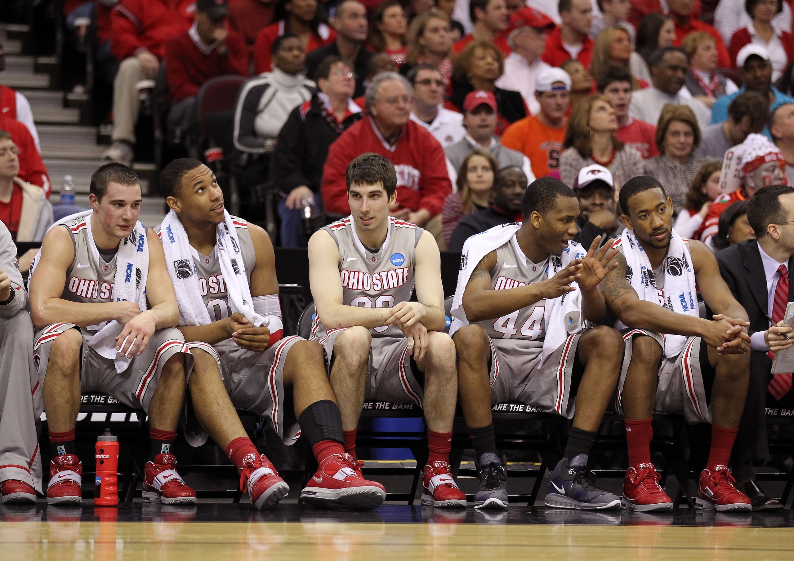 CLEVELAND, OH - MARCH 20:  Aaron Craft #4, Jared Sullinger #0, Jon Diebler #33, William Buford #44 and David Lighty #23 of the Ohio State Buckeyes look on from the bench late in the second half against the George Mason Patriots during the third of the 201