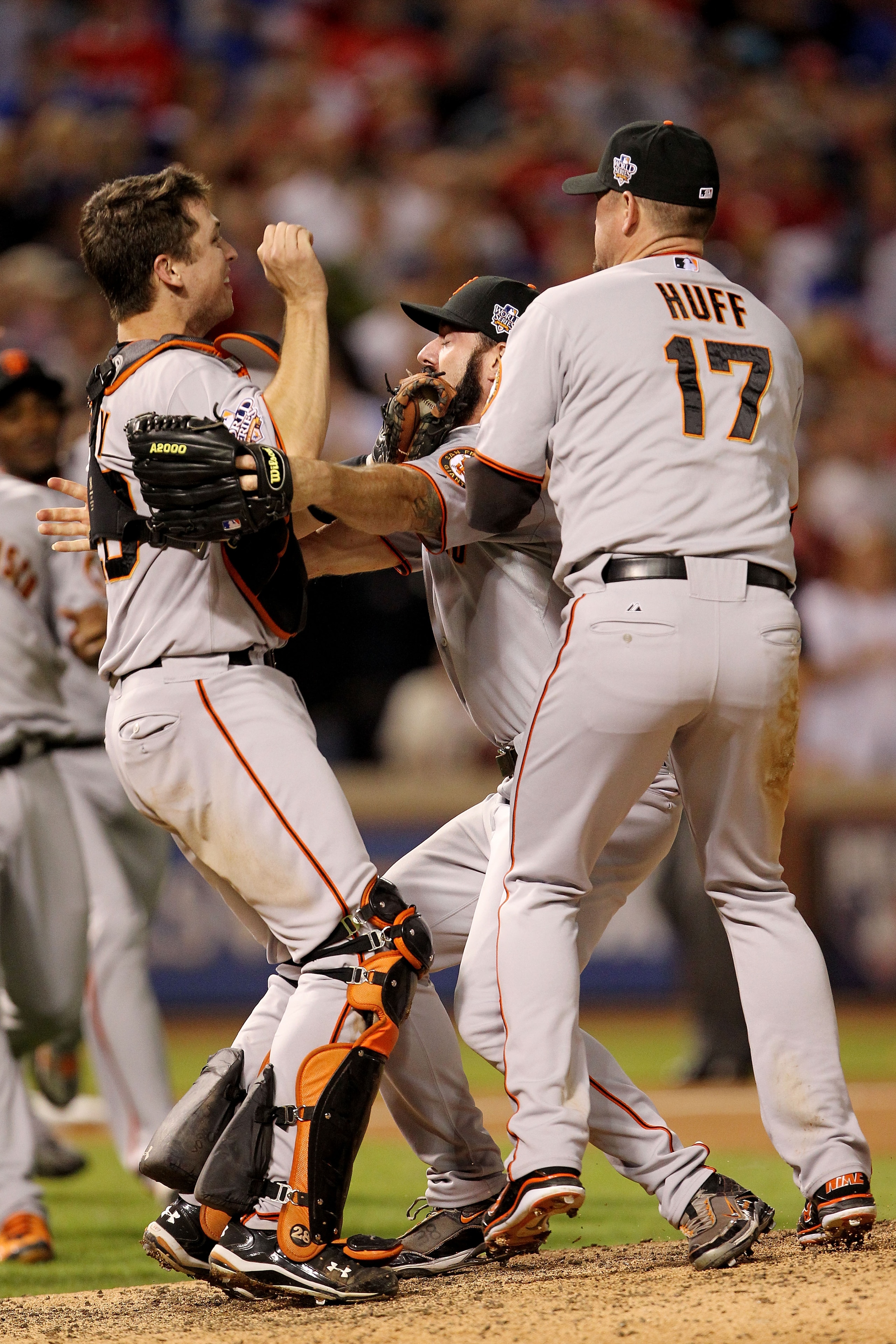 ARLINGTON, TX - NOVEMBER 01:  (L-R) Buster Posey #28, Brian Wilson #38 and Aubrey Huff #17 of  the San Francisco Giants celebrate after the Giants won 3-1 against the Texas Rangers in Game Five of the 2010 MLB World Series at Rangers Ballpark in Arlington