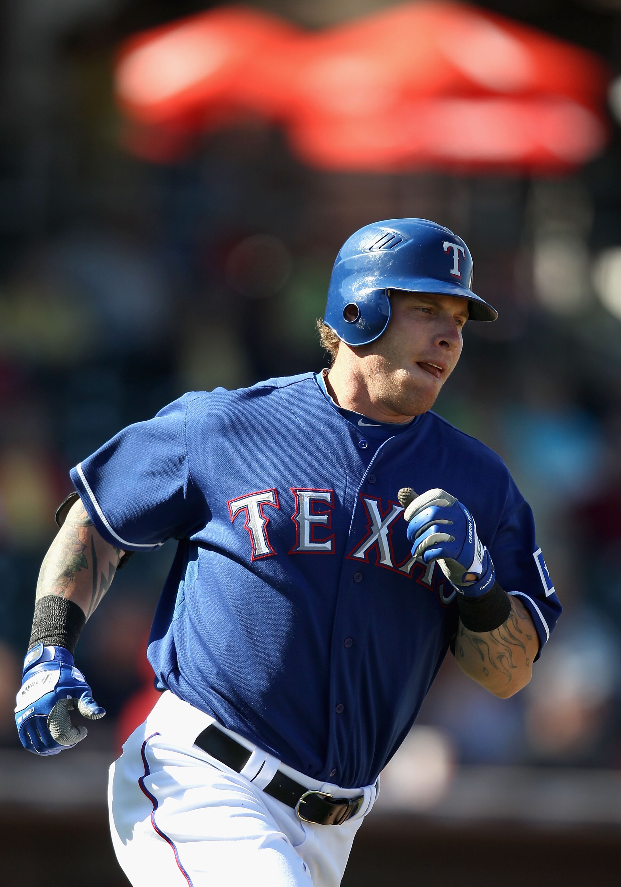 SURPRISE, AZ - MARCH 02:  Josh Hamilton #32 of the Texas Rangers runs to first base during the spring training game against the Los Angeles Angels of Anaheim at Surprise Stadium on March 2, 2011 in Surprise, Arizona.  (Photo by Christian Petersen/Getty Im