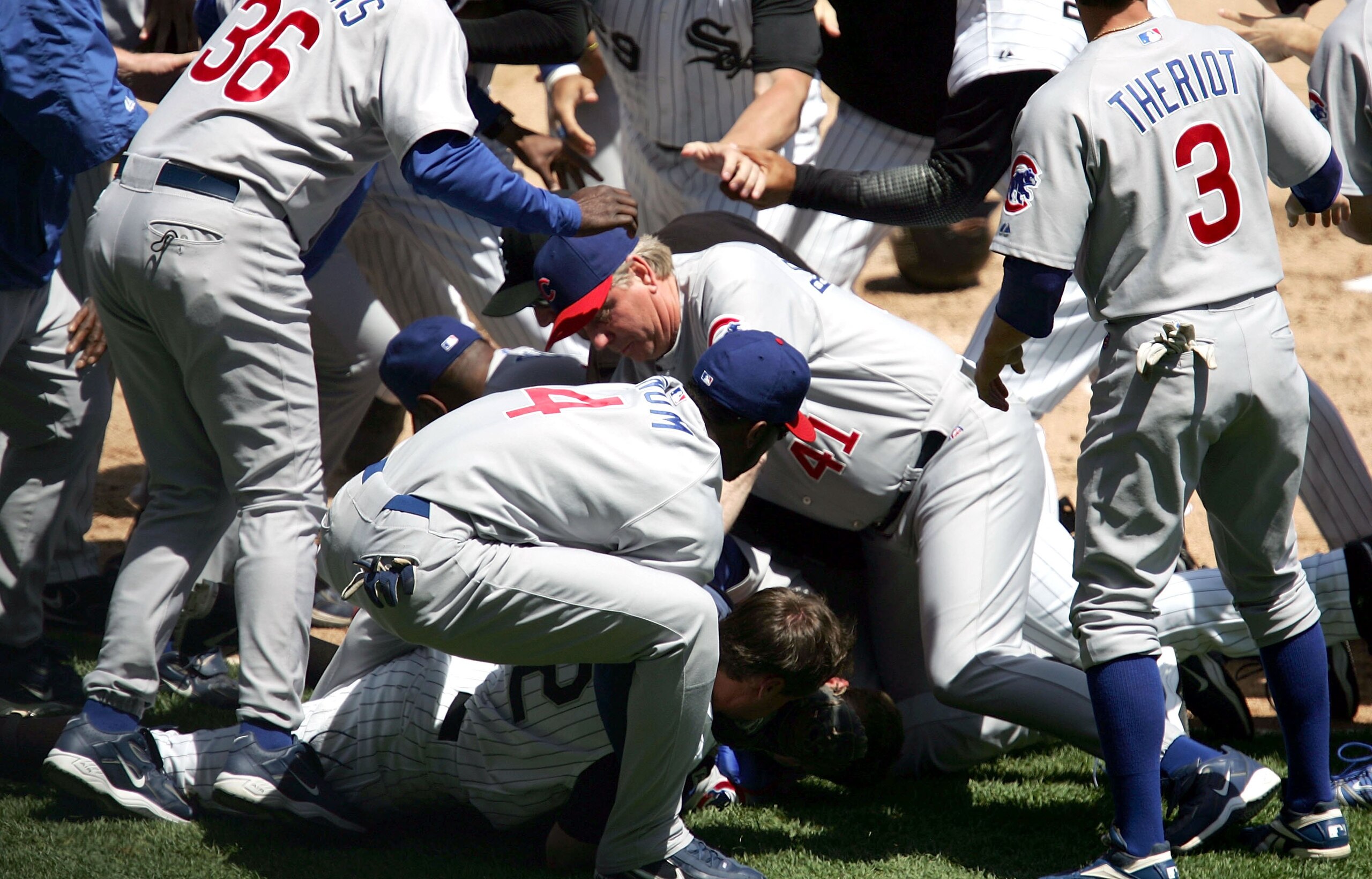 CHICAGO - MAY 20:  Pitching coach Larry Rothschild #41 of the Chicago Cubs and Freddie Bynum #4 join in the fray as members of the Chicago White Sox including Scott Podsednik #22 (on ground) and the Chicago Cubs fight in the second inning after collision