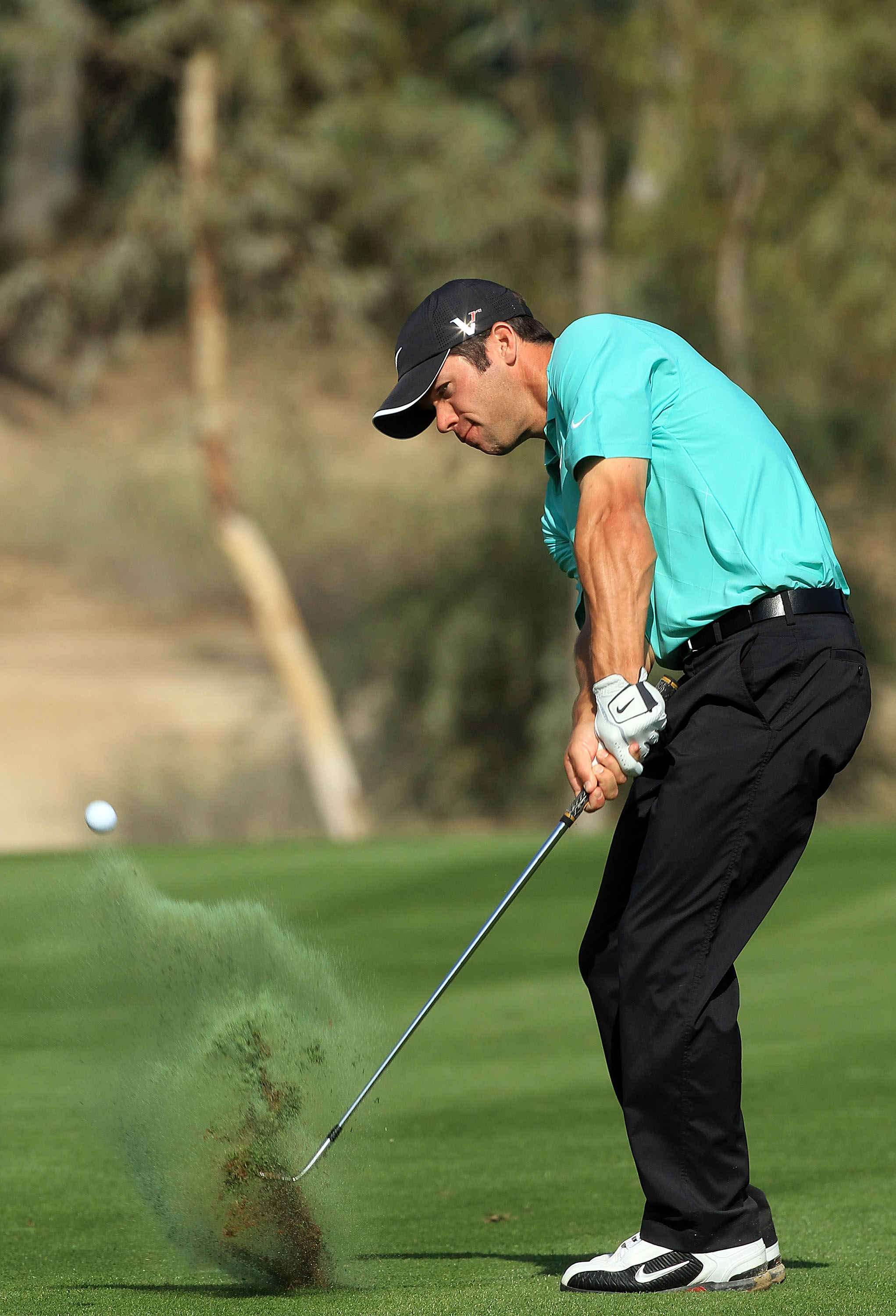 DUBAI, UNITED ARAB EMIRATES - FEBRUARY 03:  Paul Casey of England plays out of a divot at the 17th hole during the pro-am as a preview for the 2010 Omega Dubai Desert Classic on the Majilis Course at the Emirates Golf Club on February 3, 2010 in Dubai, Un