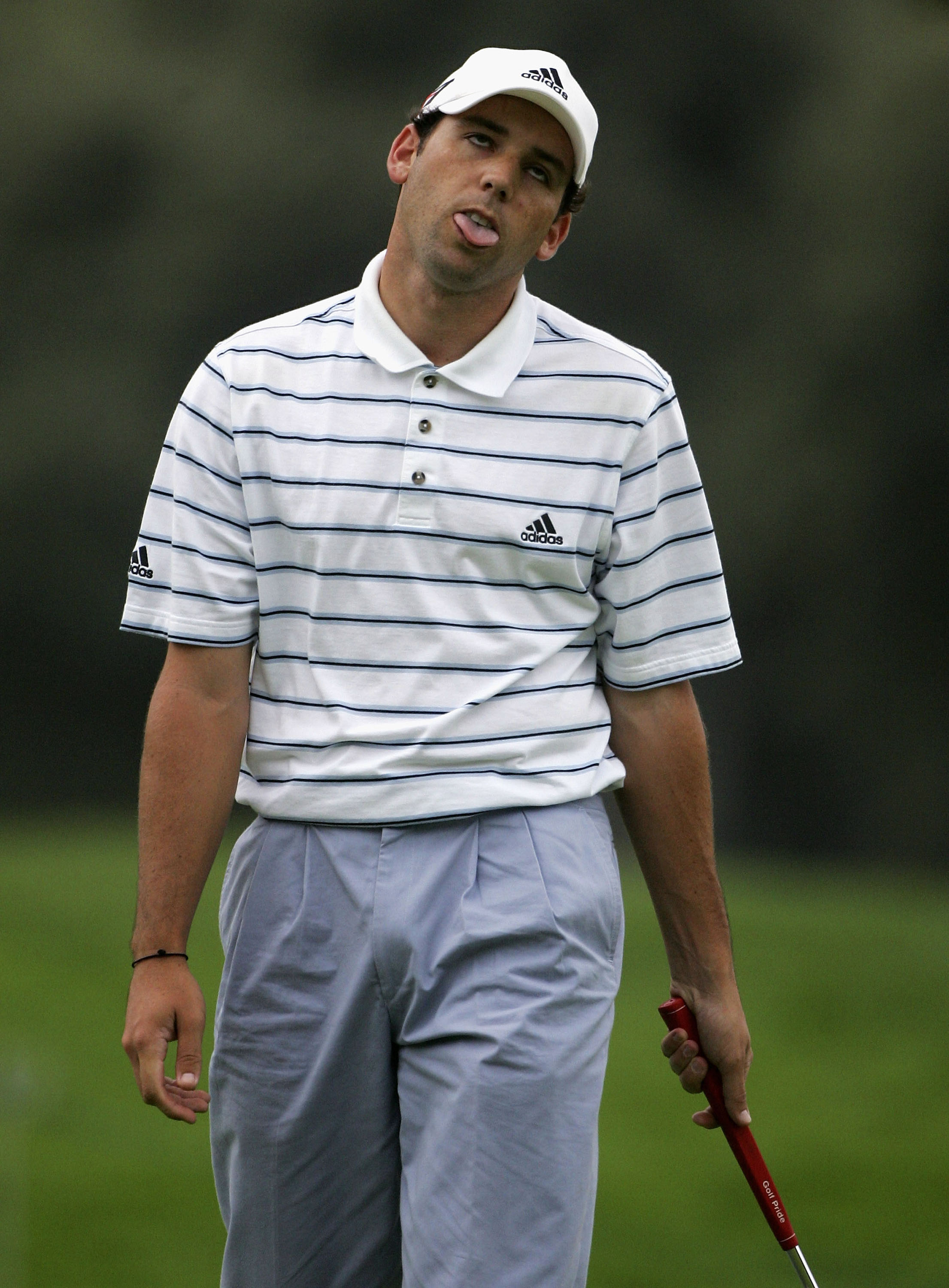 SOTOGRANDE, SPAIN - OCTOBER 28:  Sergio Garcia of Spain pulls a strange face after his bogey on the 18th hole during the second round of The Volvo Masters on October 28 2005 at Valderrama Golf Club in Sotogrande, Spain.  (Photo by Andrew Redington/Getty I