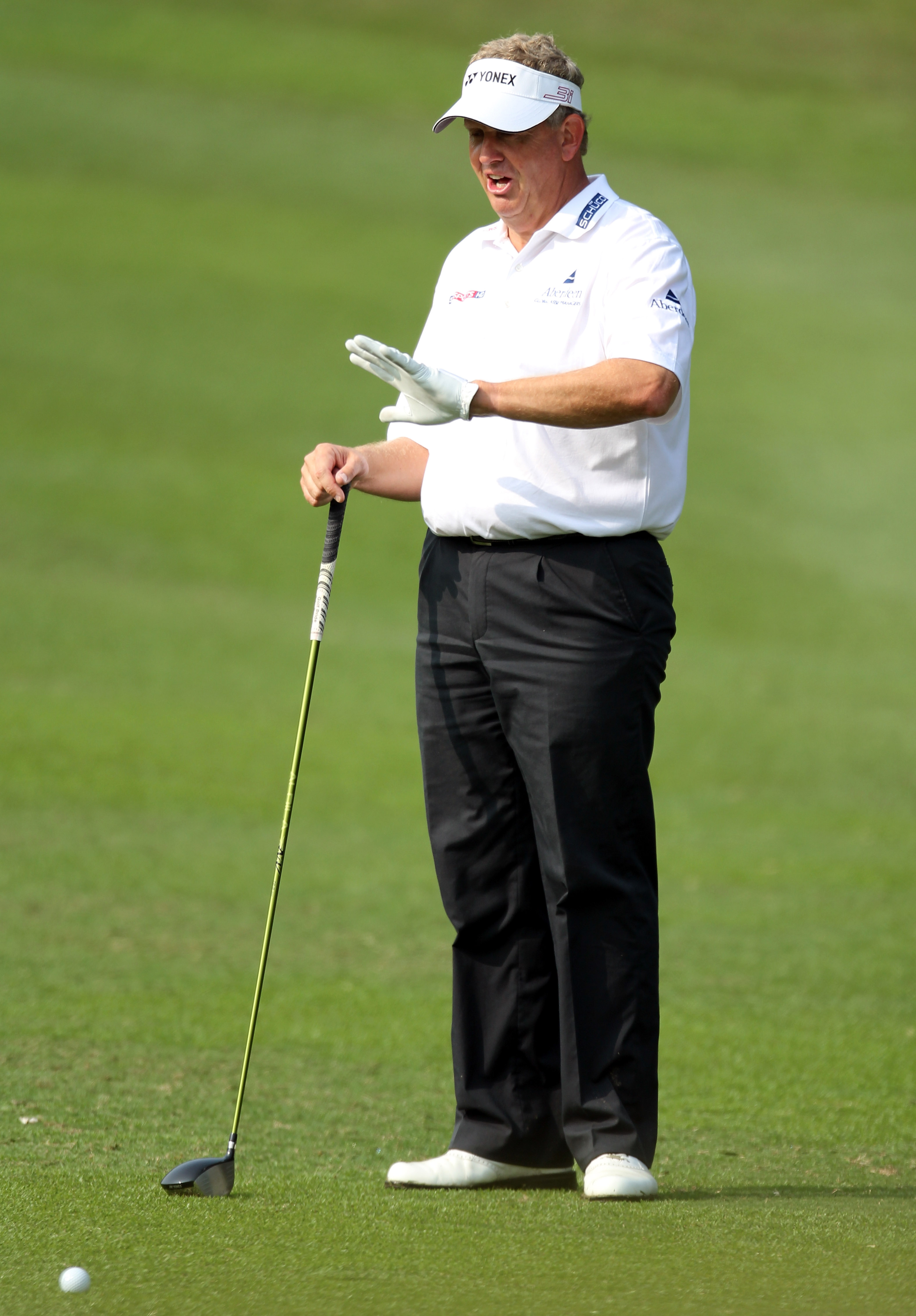 HONG KONG - NOVEMBER 19: Colin Montgomerie of Scotland asks the spectators to keep quiet on the 3rd hole  during day two of the UBS Hong Kong Open at The Hong Kong Golf Club on November 19, 2010 in Hong Kong, Hong Kong. ( Photo by Stanley Chou/Getty Image