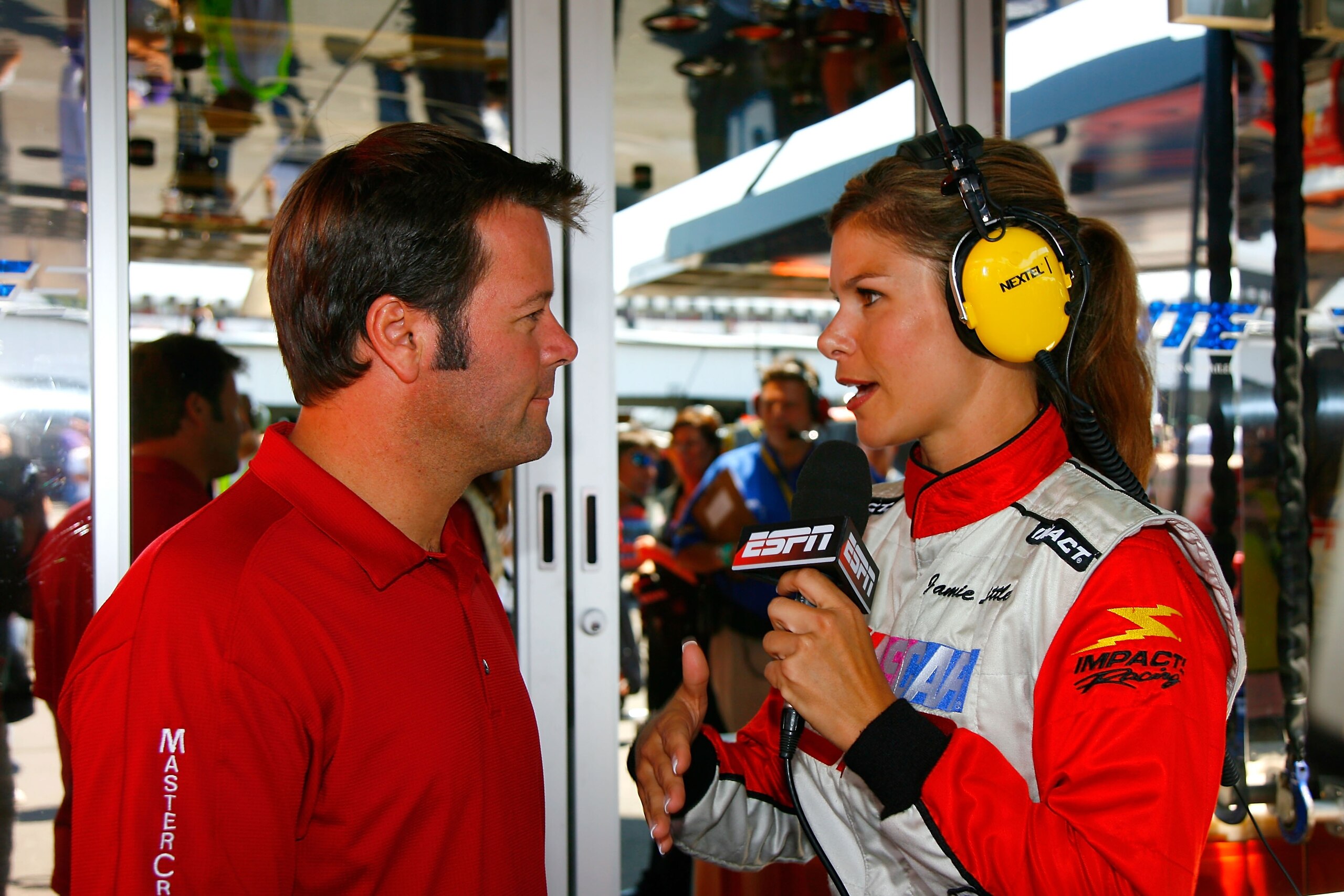 LONG POND, PA - AUGUST 05:  Robby Gordon, driver of the #7 Menards/MAPEI Ford, is interviewed by ESPN correspondent Jamie Little prior to the NASCAR Nextel Cup Series Pennsylvania 500 at Pocono Raceway on August 5, 2007 in Long Pond, Pennsylvania. Gordon