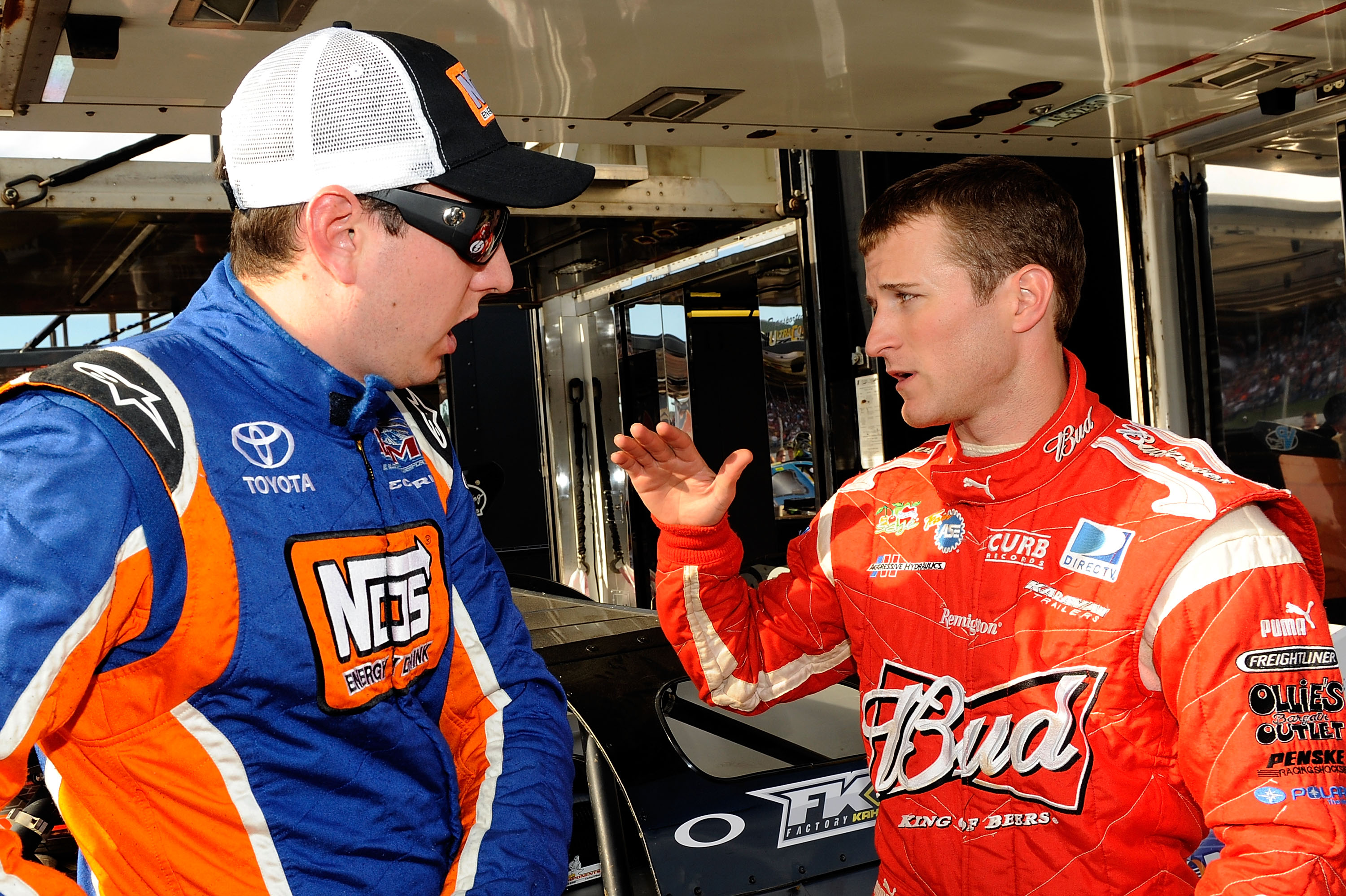 ROSSBURG, OH - JUNE 09:  Kyle Busch,driver of the #18 NOS Energy late model Toyota, talks with Kasey Kahne, driver of the #9 Budweiser late model Ford, prior to the Gillette Fusion ProGlide Prelude to the Dream at Eldora Speedway on June 9, 2010 in Rossbu