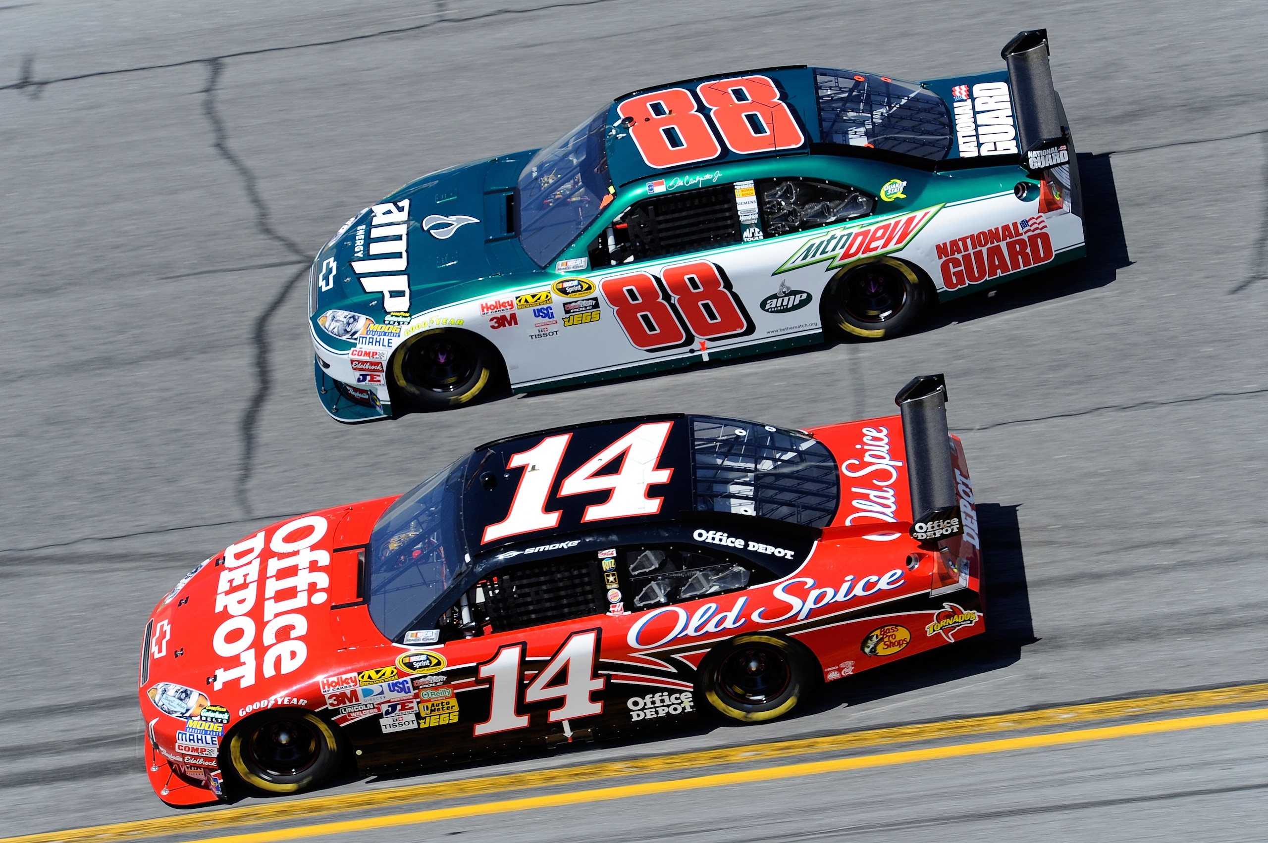 DAYTONA BEACH, FL - FEBRUARY 14:  Tony Stewart, driver of the #14 Old Spice/Office Depot Chevrolet, races Dale Earnhardt Jr., driver of the #88 AMP Energy/National Guard Chevrolet, during the NASCAR Sprint Cup Series Daytona 500 at Daytona International S