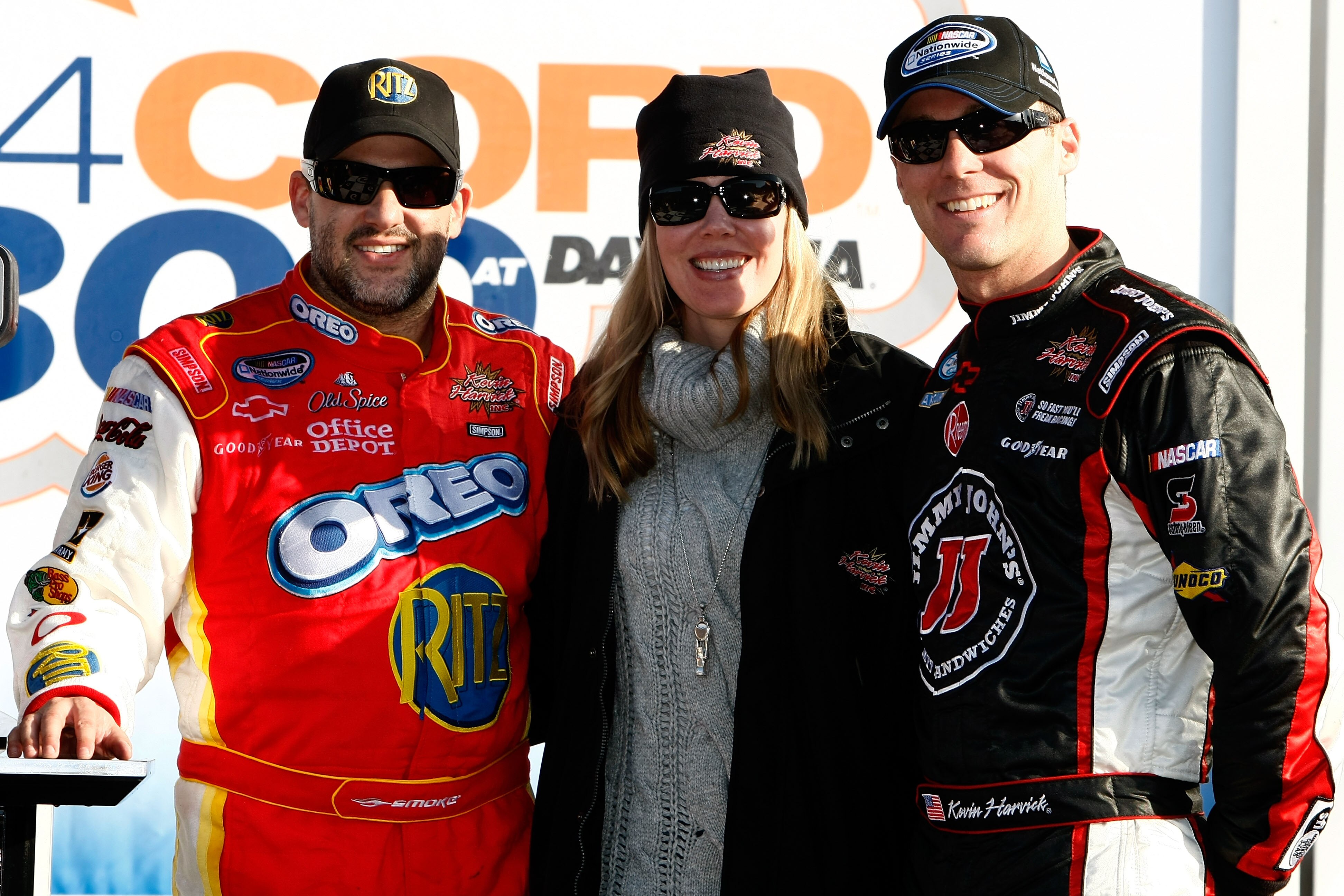 DAYTONA BEACH, FL - FEBRUARY 13:  Tony Stewart, driver of the #4 Ritz Crackers Chevrolet, celebrates in Victory Lane after winning the NASCAR Nationwide Series Drive4COPD 300 with Kevin Harvick, third place, driver of the #33 Jimmy John's Chevrolet, and w