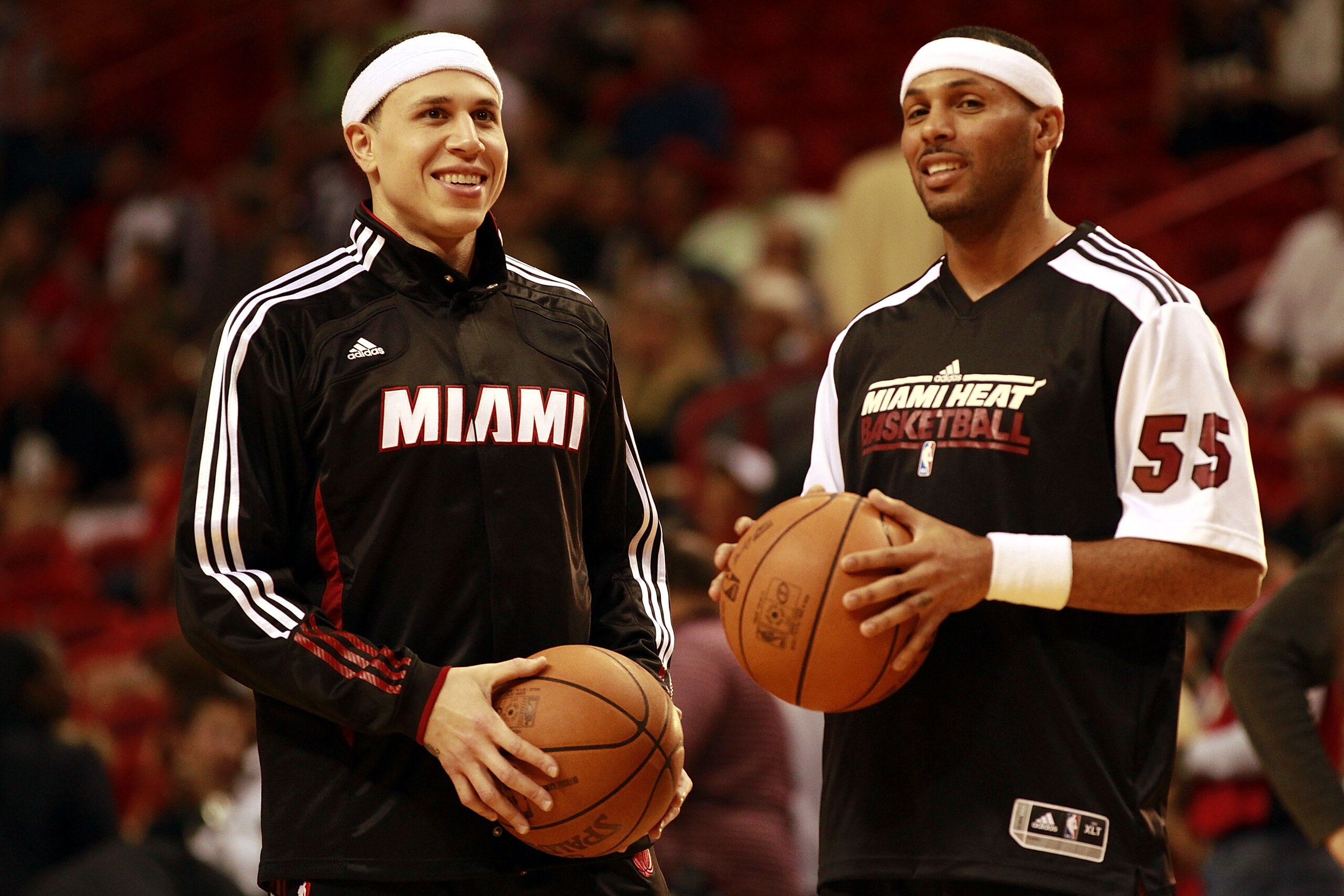 MIAMI - MARCH 12:  Guard Mike Bibby #0 of the Miami Heat (L) chats with teamate Eddie House #55  against the Memphis Grizzlie at American Airlines Arena on March 12, 2011 in Miami, Florida. NOTE TO USER: User expressly acknowledges and agrees that, by dow